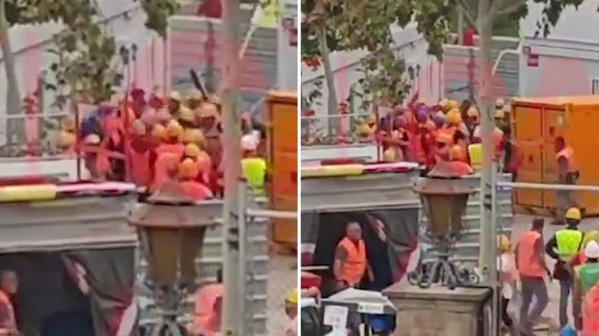 Watch shocking moment 30 Nou Camp construction workers brawl with wooden sticks and stones in horror scenes