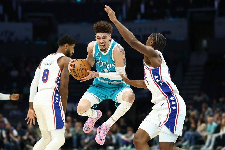 LOOK: LaMelo Ball leaps between Tyrese Maxey and Paul George and other pictures of the day in the NBA