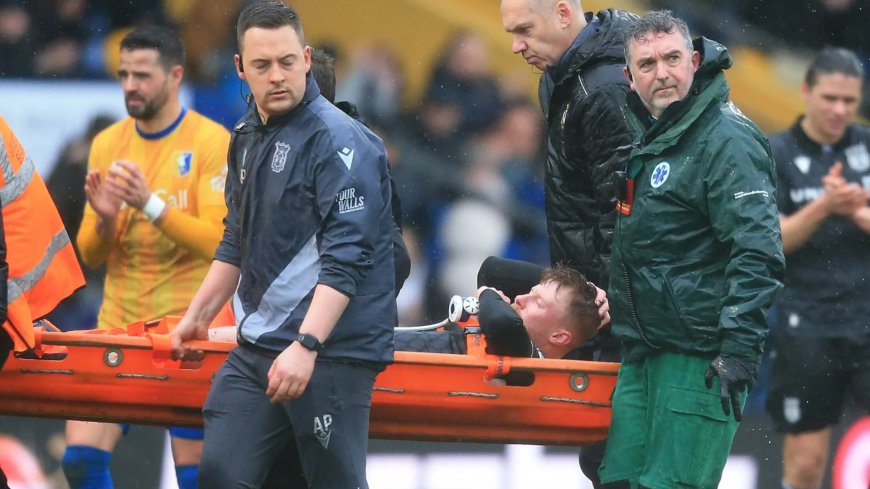 Wrexham player given oxygen and goes off on stretcher in injury scare