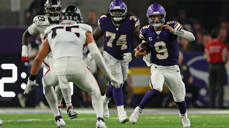 Minnesota Vikings quarterback J.J. McCarthy (9) runs the ball during the second half against the Atlanta Falcons at U.S. Bank Stadium.