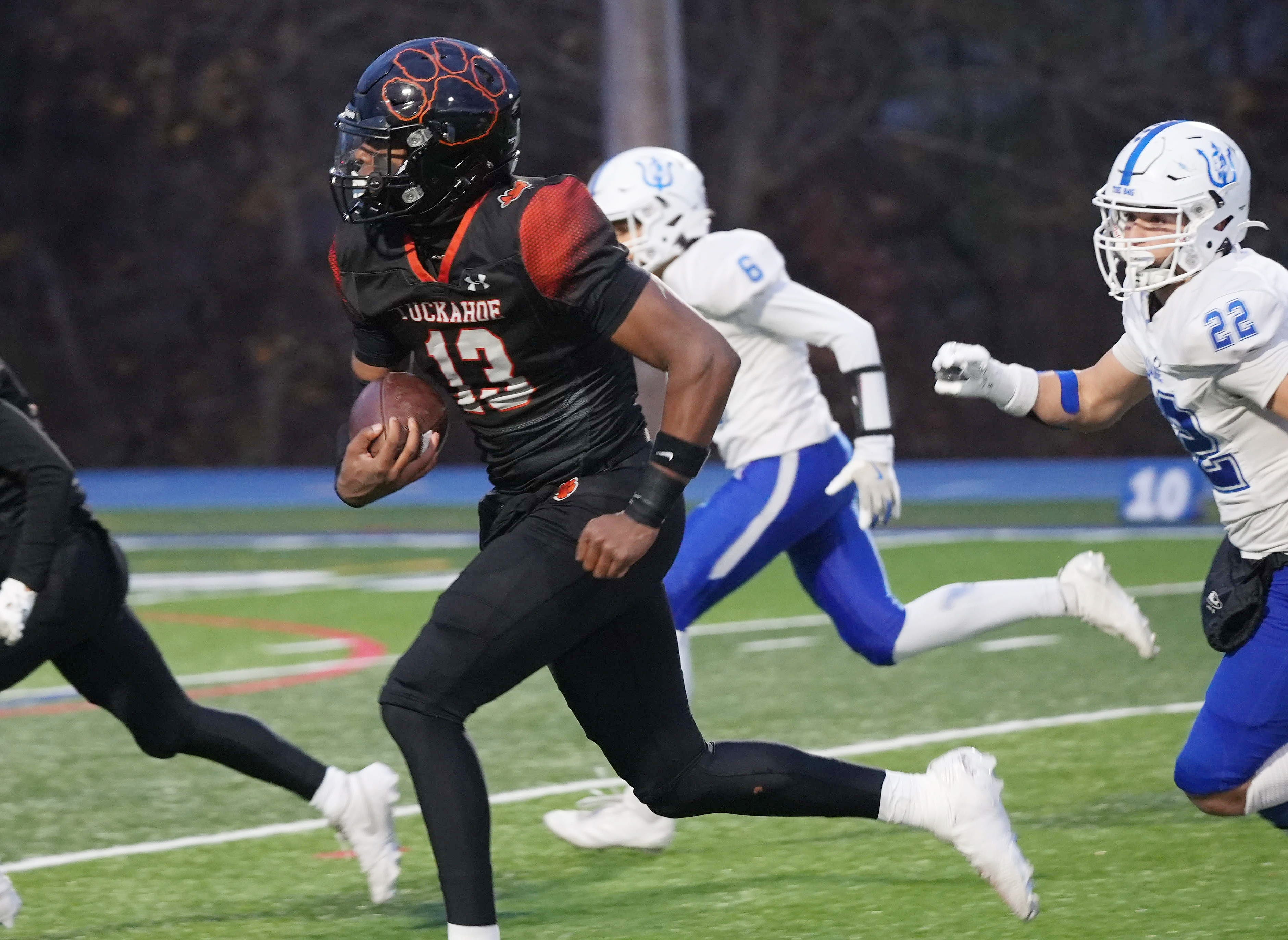 Tuckahoe&rsquo;s Connor Brice (13) gets by a pair of Haldane defenders on 9s way to a first half touchdown during the Section 1 football Class D championship at Mahopac High School Nov. 14, 2025.