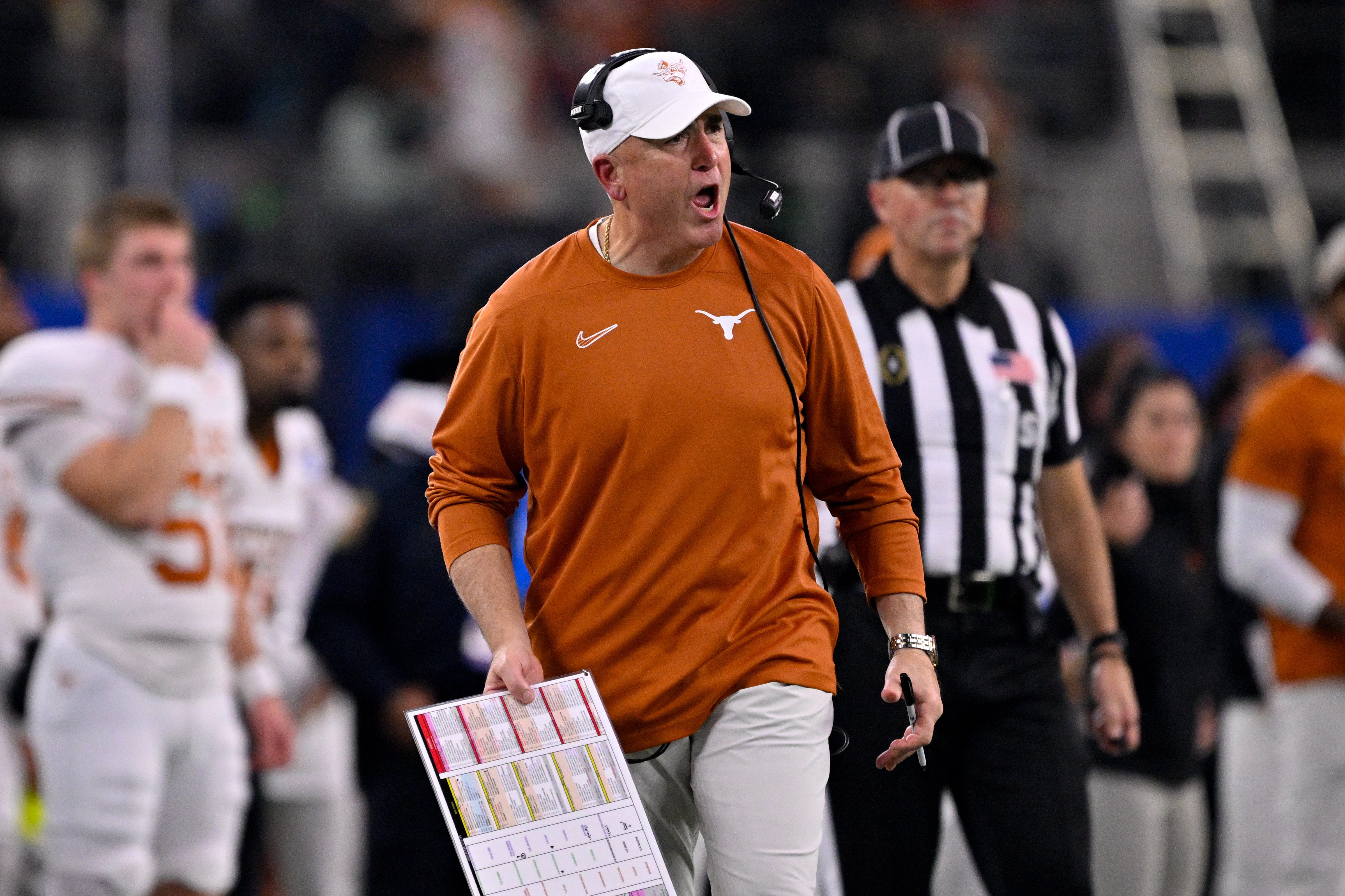 Jan 10, 2025; Arlington, TX, USA; Texas Longhorns offensive coordinator Kyle Flood during the game between the Texas Longhorns and the Ohio State Buckeyes at AT&T Stadium. Mandatory Credit: Jerome Miron-Imagn Images