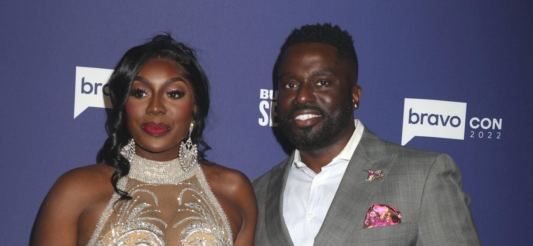 Wendy and Eddie Osefo posing on the red carpet.