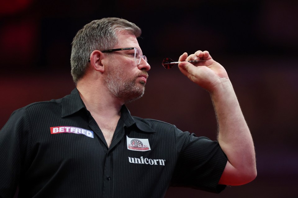 BLACKPOOL, ENGLAND - JULY 27: James Wade of England throws during the Final match between James Wade of England and Luke Littler of England on day nine of the 2025 Betfred World Matchplay at Winter Gardens on July 27, 2025 in Blackpool, England. (Photo by Lewis Storey/Getty Images)
