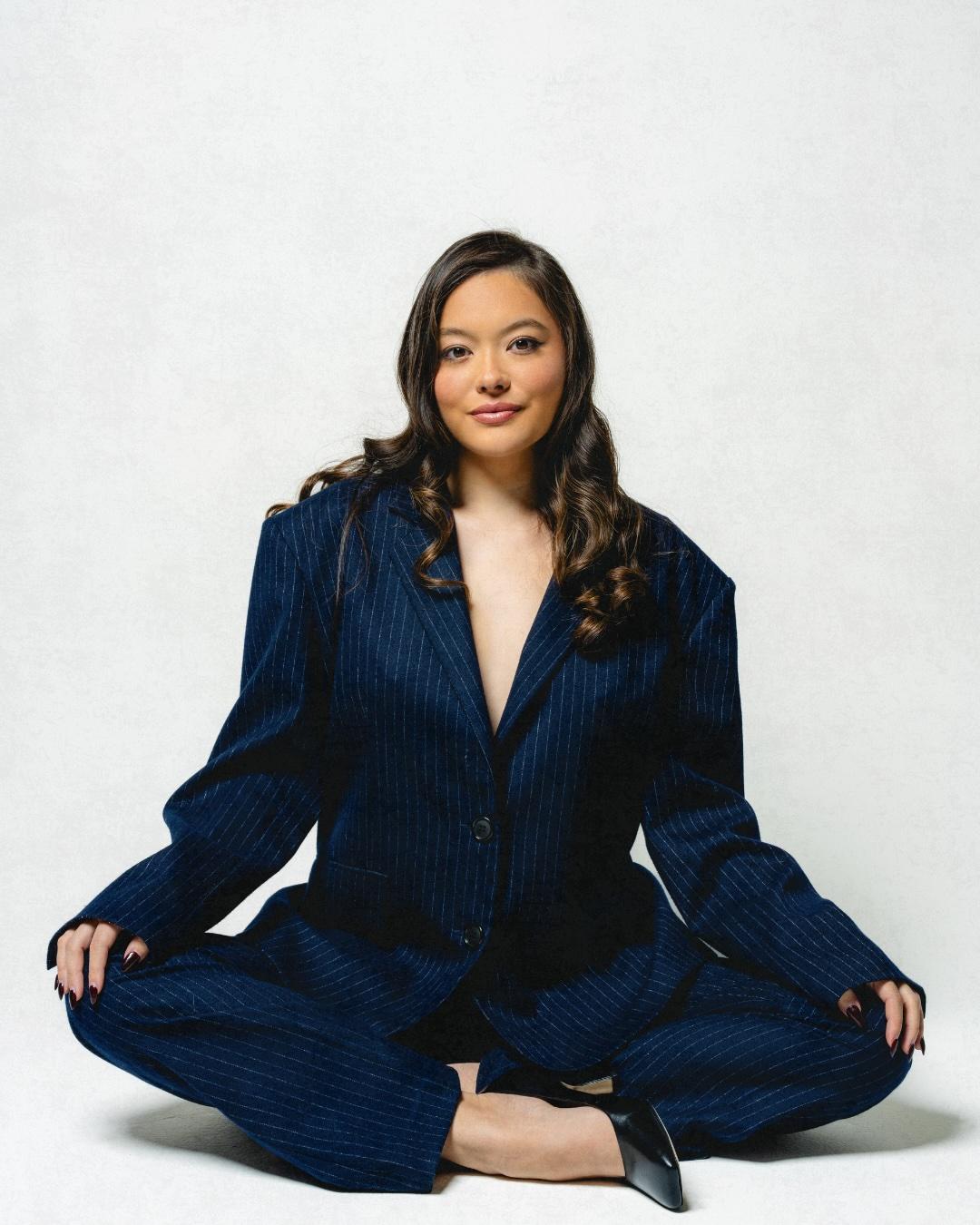 Kristi Cook sitting on ground