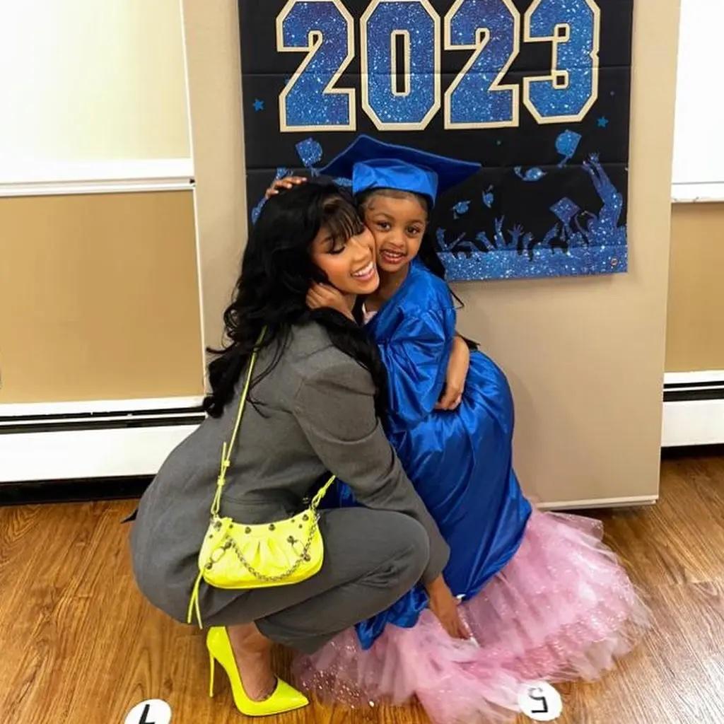 Cardi B hugs her daughter