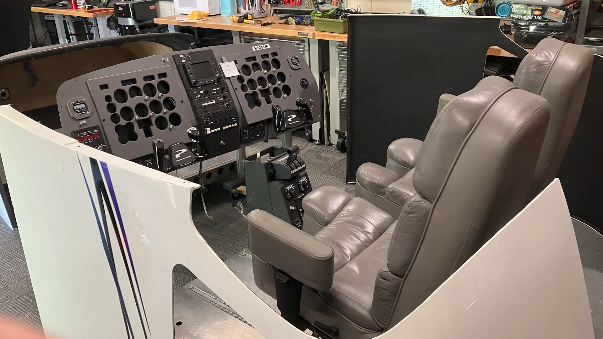 A shot of an FAA-approved flight simulator setup with the roof removed