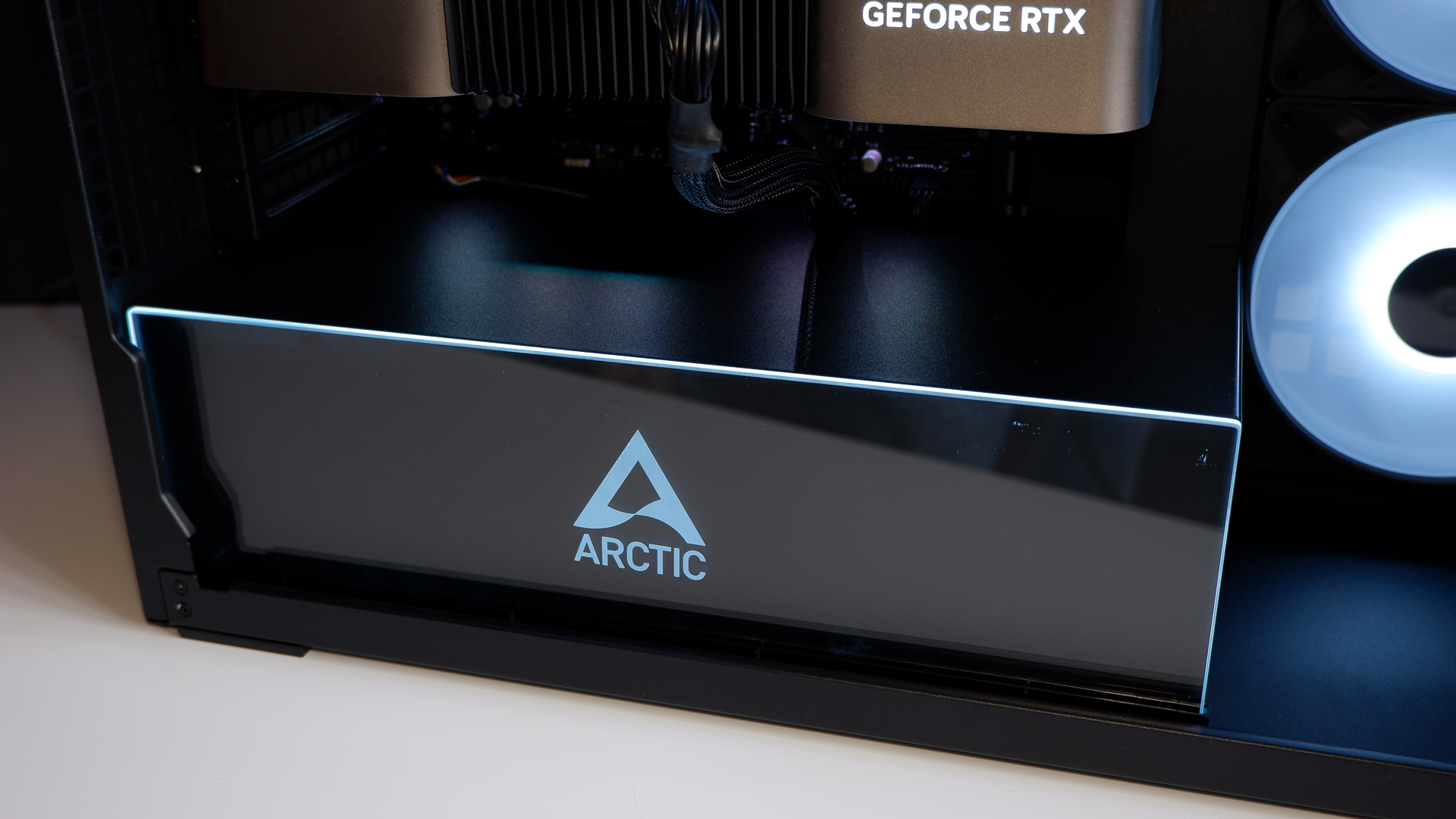 Arctic's Xtender PC case on a white desk with various parts being installed to build a functional gaming PC.