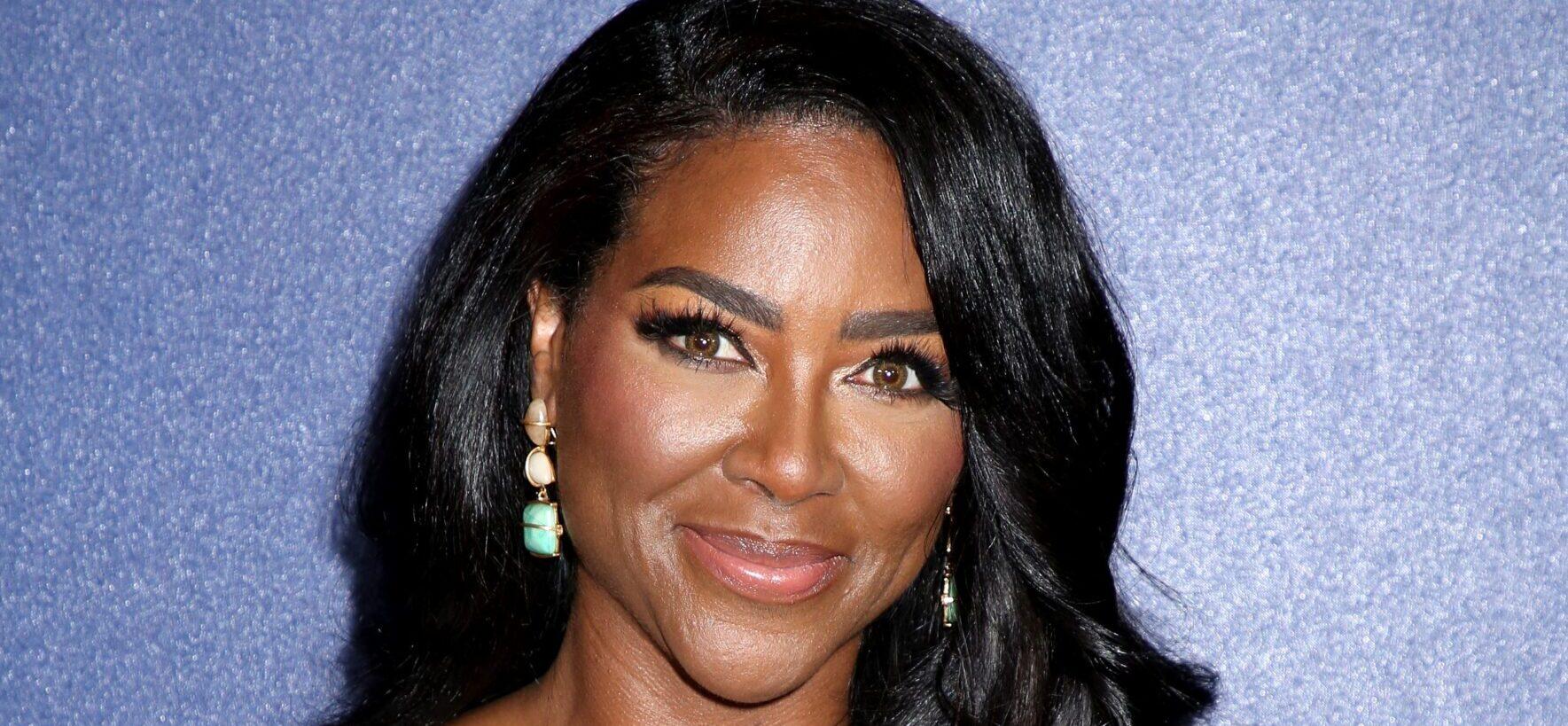 Kenya Moore posing on the red carpet.