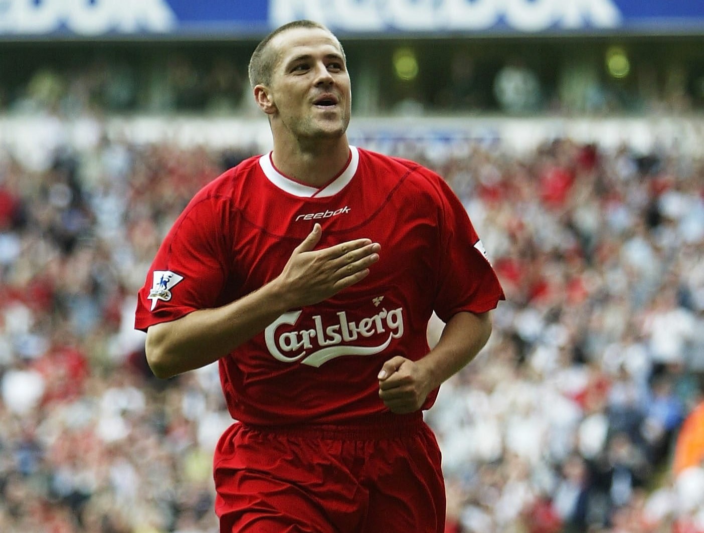 Michael Owen of Liverpool celebrating after scoring a penalty goal.