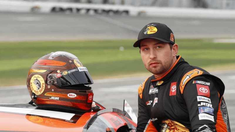 Feb 16, 2025; Daytona Beach, Florida, USA; NASCAR Cup Series driver Chase Briscoe (19) prepares to get in the car after a rain delay for the Daytona 500 at Daytona International Speedway. Mandatory Credit: Peter Casey-Imagn Images