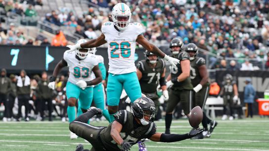 Dec 7, 2025; East Rutherford, New Jersey, USA; New York Jets wide receiver Adonai Mitchell (15) dives for the ball against the Miami Dolphins during the first half at MetLife Stadium.