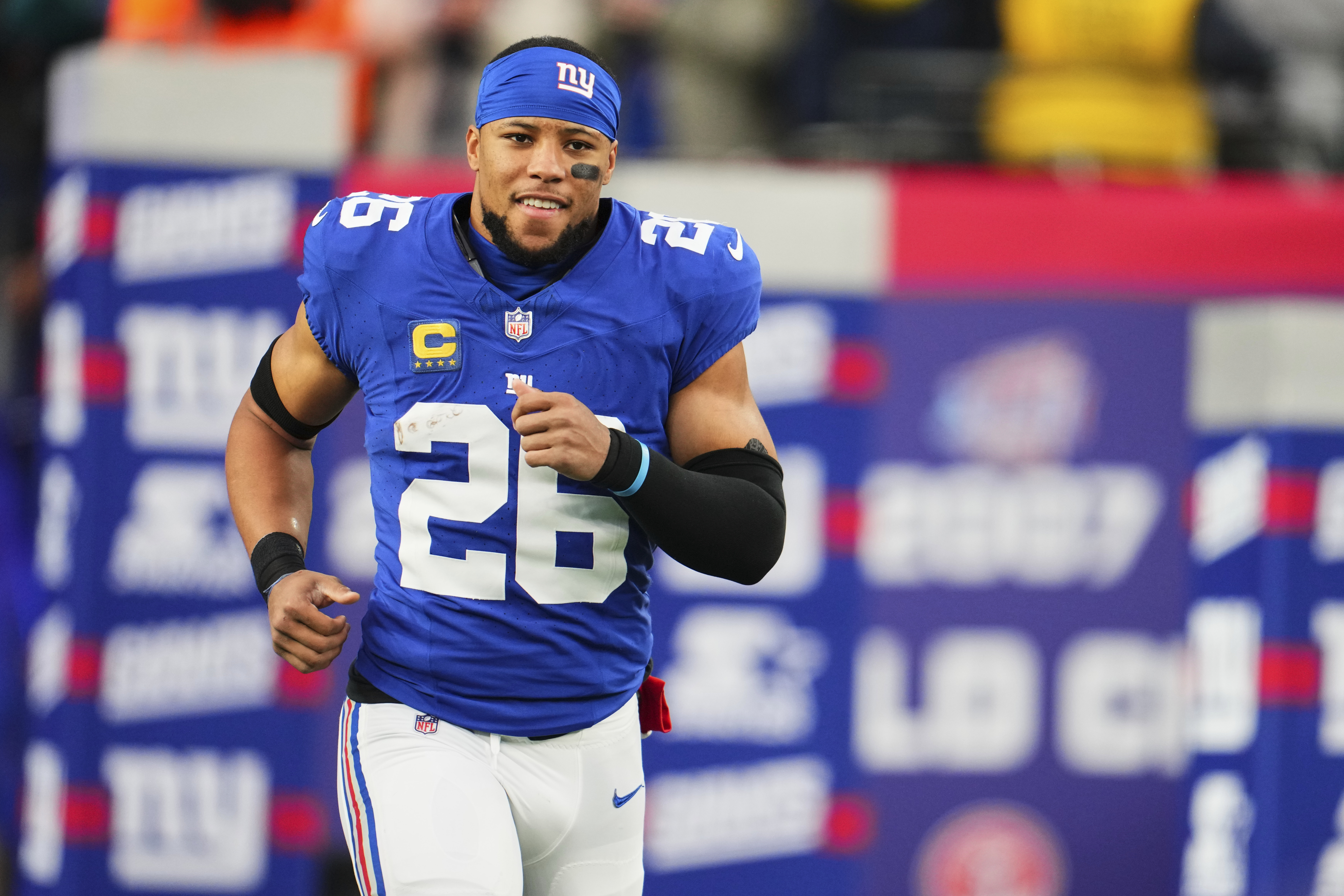 EAST RUTHERFORD, NJ - JANUARY 07: Saquon Barkley #26 of the New York Giants takes the field before kickoff against the Philadelphia Eagles at MetLife Stadium on January 7, 2024 in East Rutherford, New Jersey. (Photo by Cooper Neill/Getty Images)