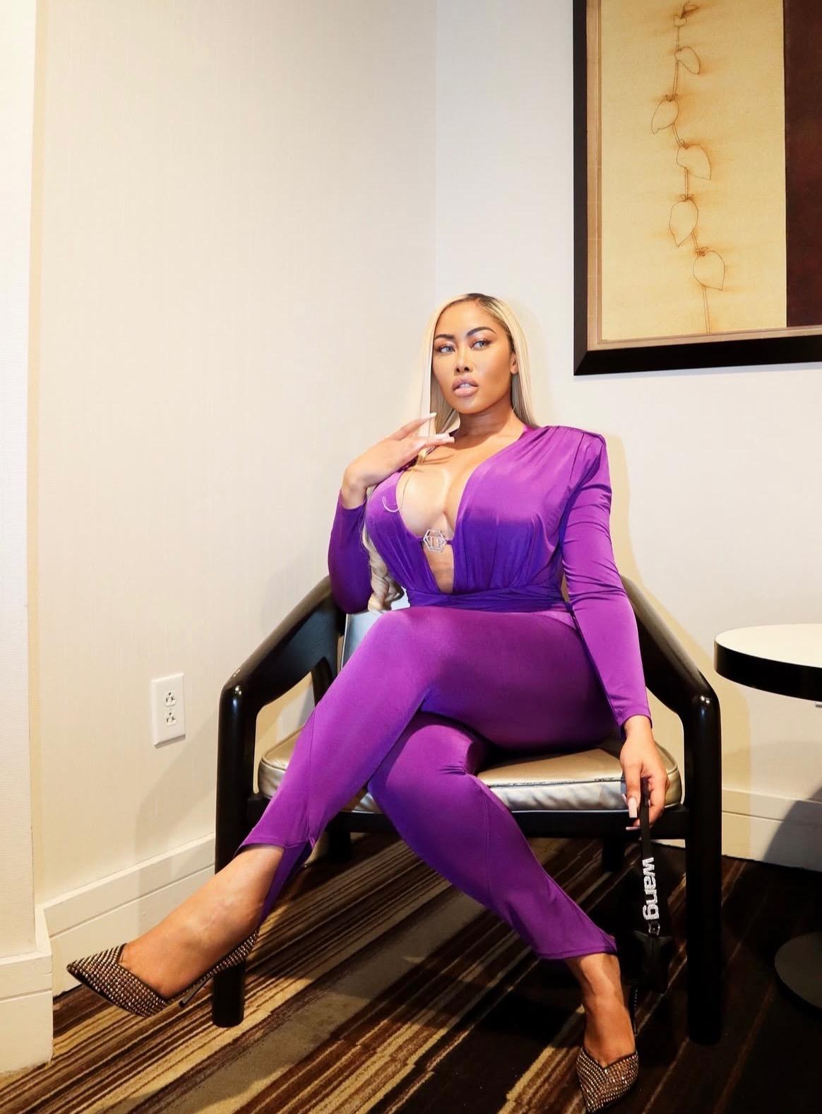 Moriah Mills in purple outfit