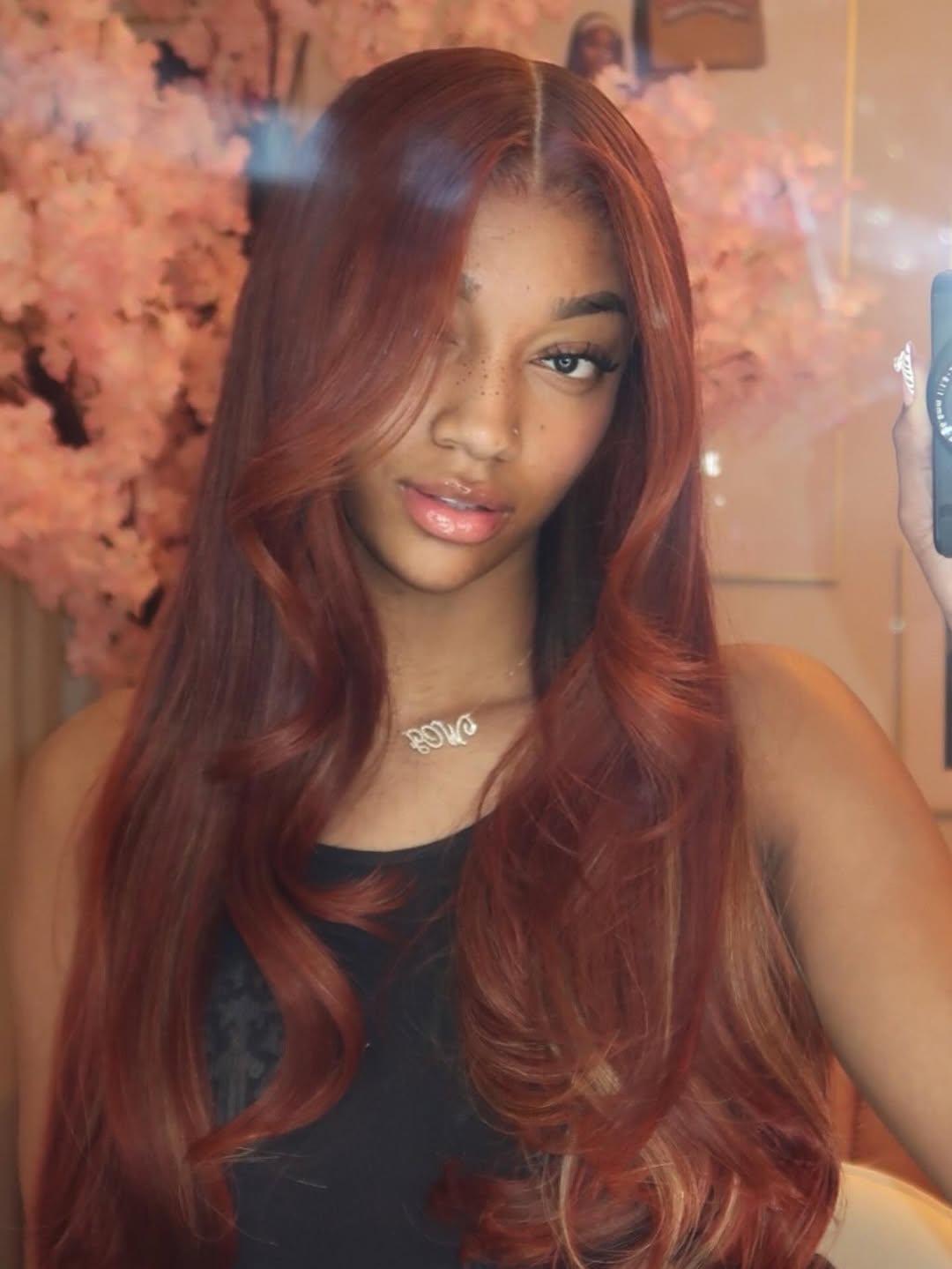 Angel Reese taking a selfie.