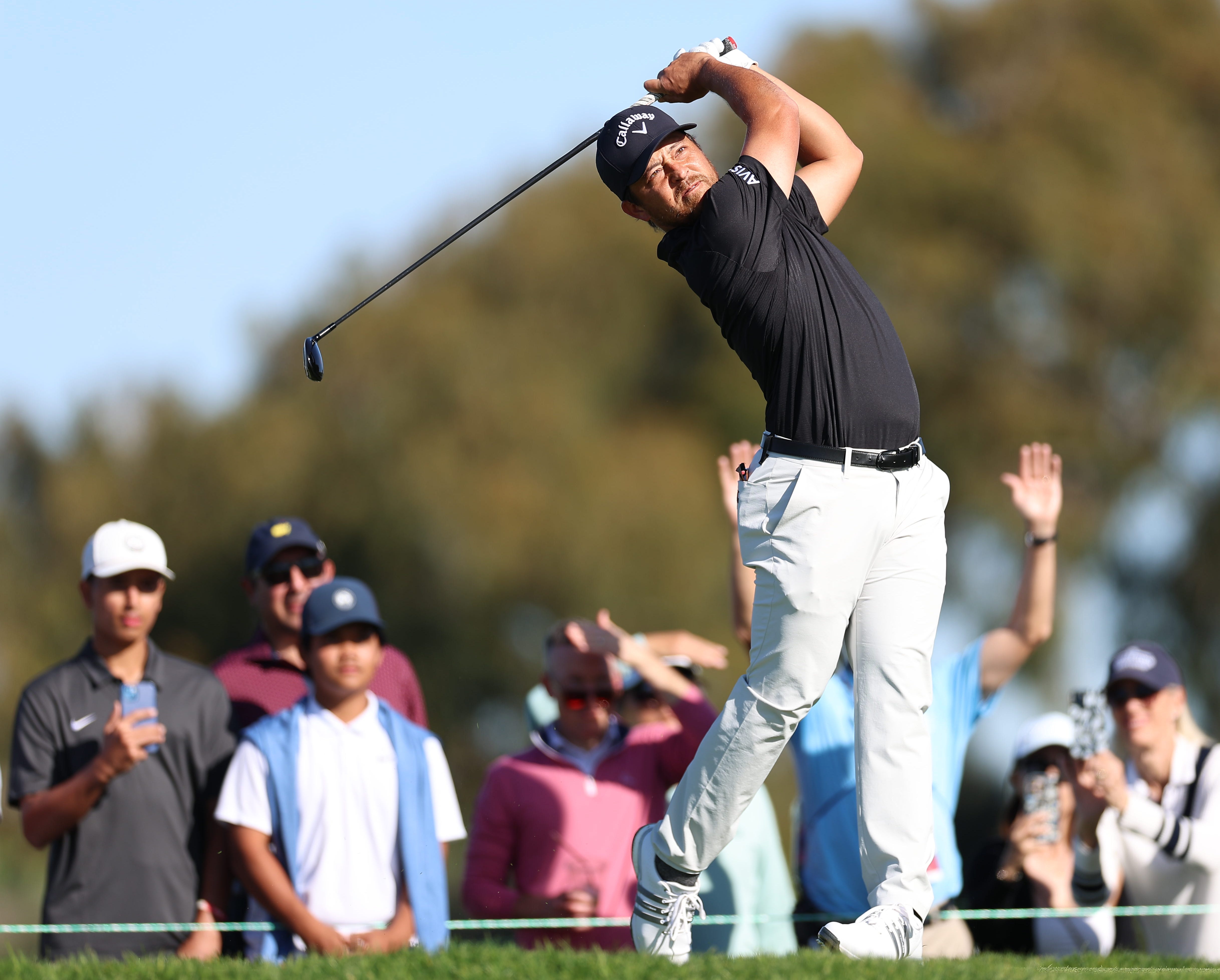 Xander Schauffele plays his shot from the second tee during the first round of the 2026 Farmers Insurance Open at Torrey Pines.