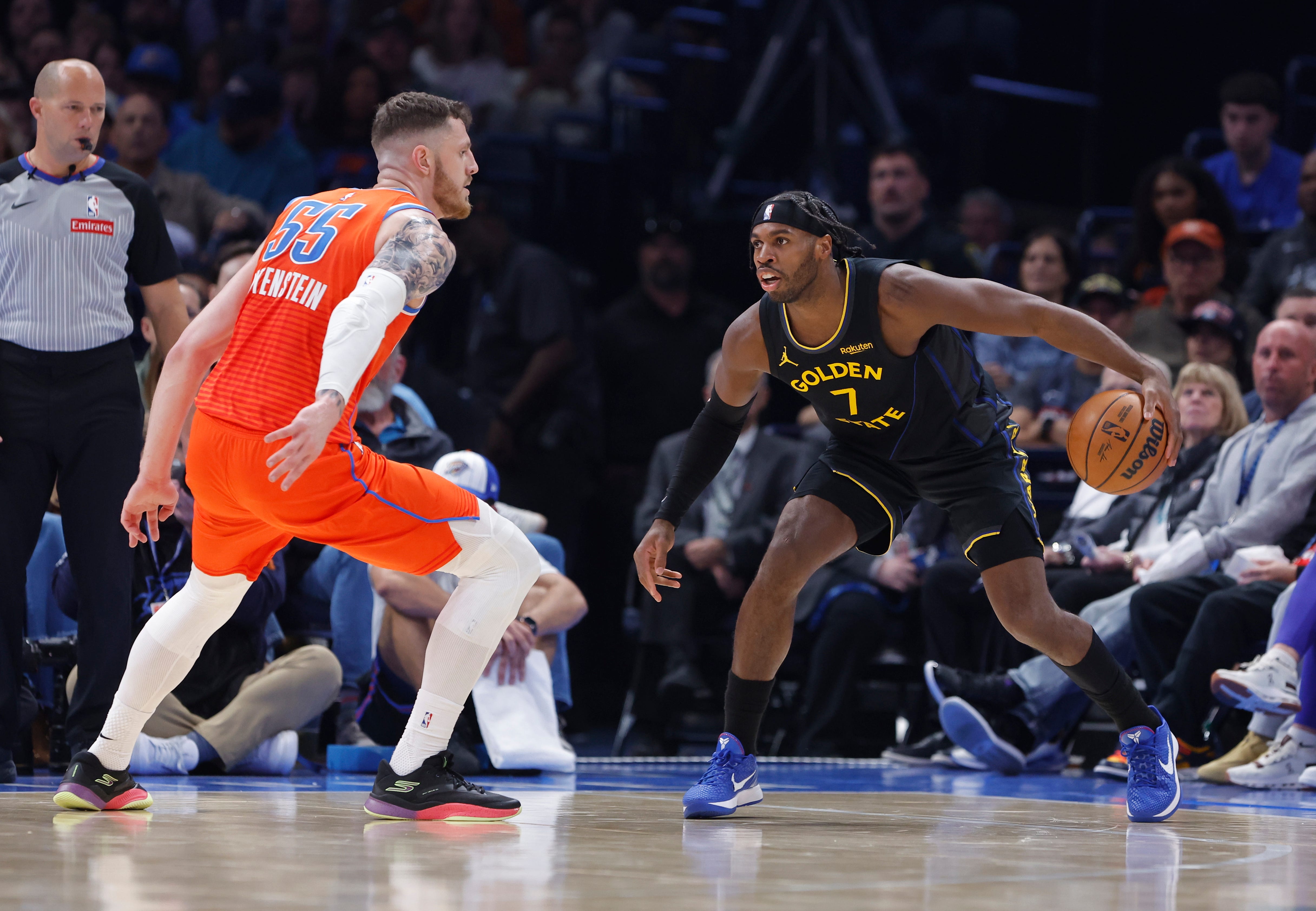 Nov 11, 2025; Oklahoma City, Oklahoma, USA; Golden State Warriors guard Buddy Hield (7) moves the ball as Oklahoma City Thunder center Isaiah Hartenstein (55) defends during the second quarter at Paycom Center. Mandatory Credit: Alonzo Adams-Imagn Images