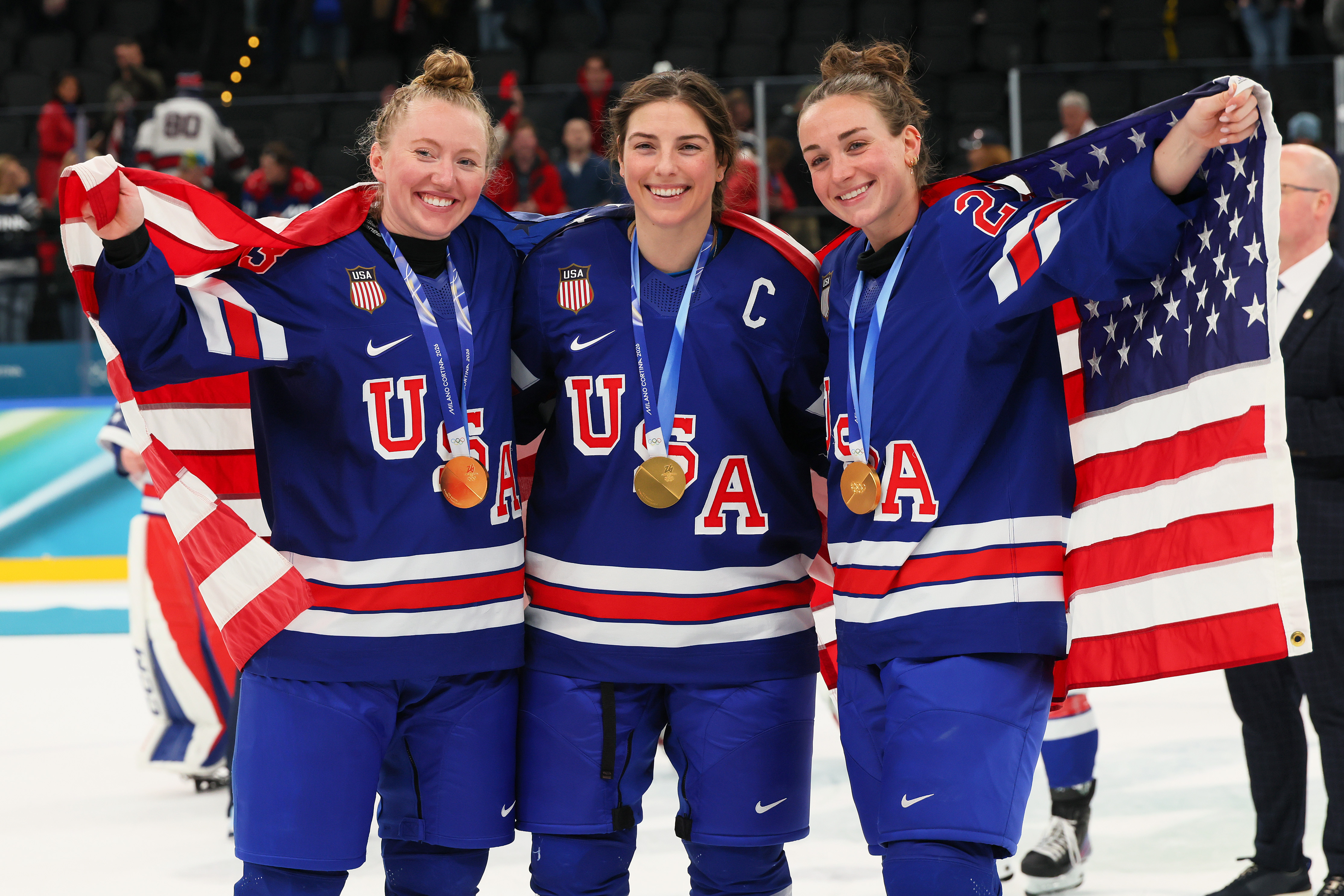 MILAN, ITALY - FEBRUARY 19: (L-R) Gold medalists Grace Zumwinkle #13, Hilary Knight #21 and Taylor Heise #27 of Team United States pose after the medal ceremony for Women's Ice Hockey following the Women's Gold Medal match between the United States and Canada on day 13 of the Milano Cortina 2026 Winter Olympic games at Milano Santagiulia Ice Hockey Arena on February 19, 2026 in Milan, Italy. (Photo by Bruce Bennett/Getty Images)