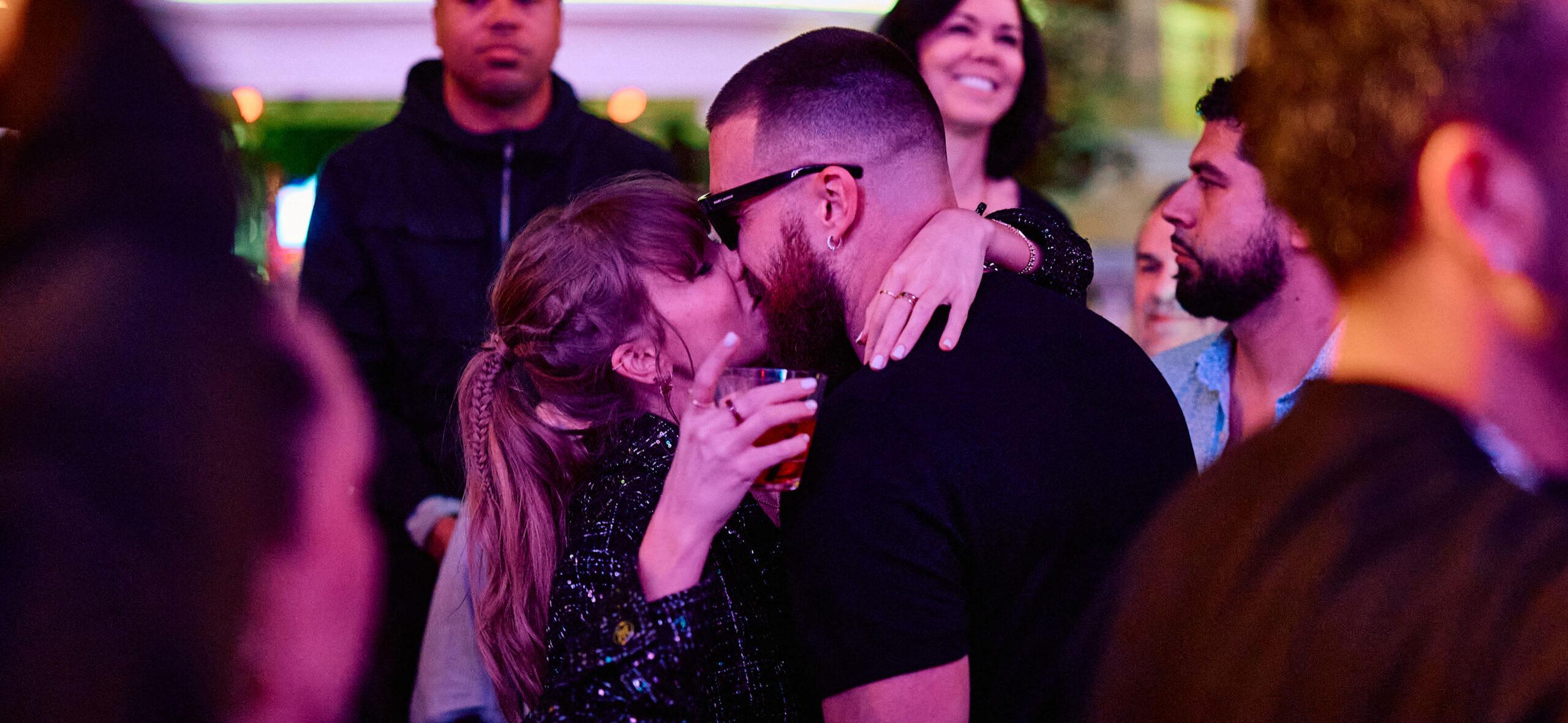Taylor Swift and Travis Kelce share a kiss at XS Nightclub as Kansas City Chiefs celebrate Super Bowl win