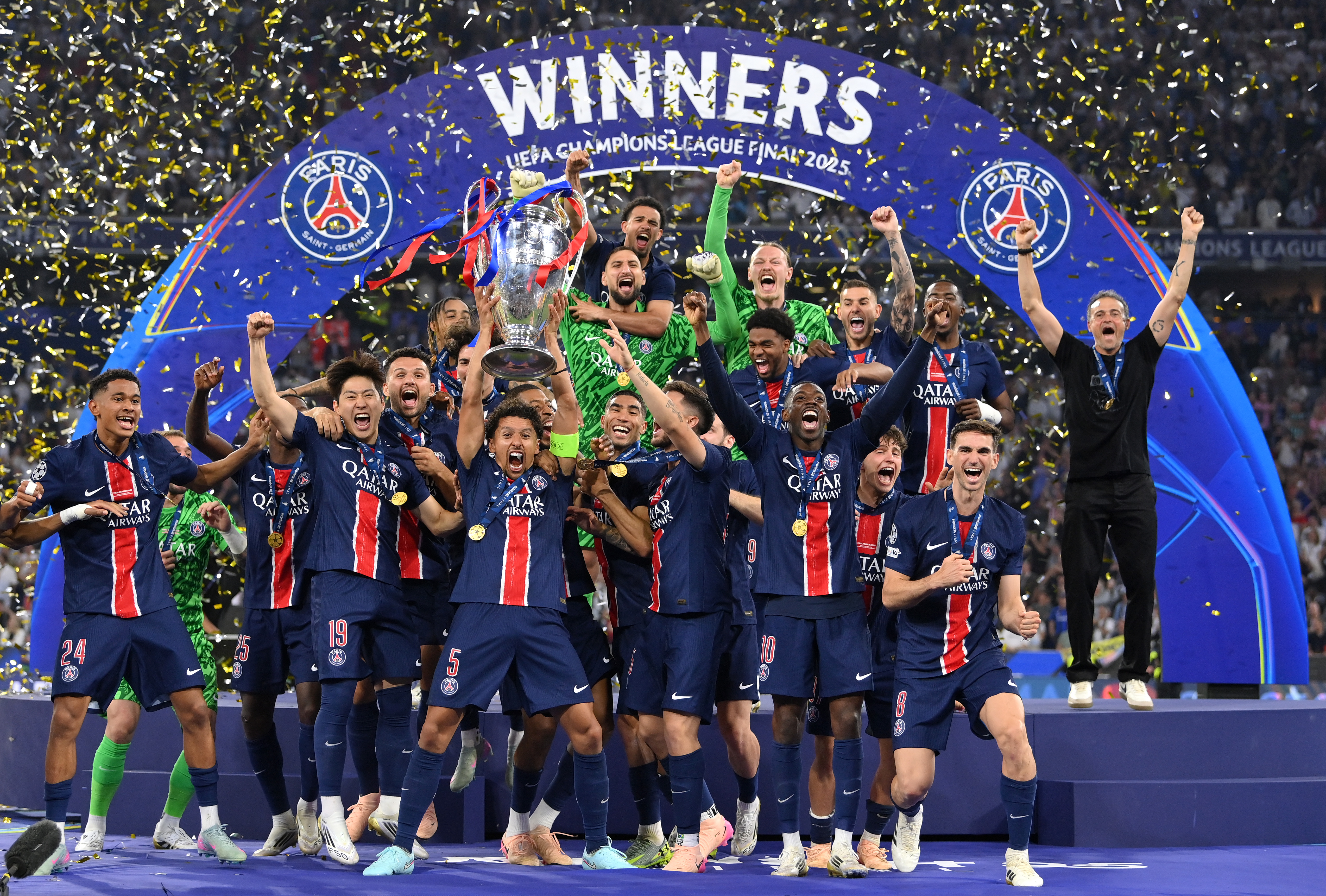 MUNICH, GERMANY - MAY 31: Marquinhos of Paris Saint-Germain lifts the UEFA Champions League trophy after his team's victory, to secure Paris Saint-Germain's first ever UEFA Champions League title in the club's history and a record UEFA Champions League Final winning scoreline of 5-0, following the UEFA Champions League Final 2025 between Paris Saint-Germain and FC Internazionale Milano at Munich Football Arena on May 31, 2025 in Munich, Germany. (Photo by Justin Setterfield/Getty Images)