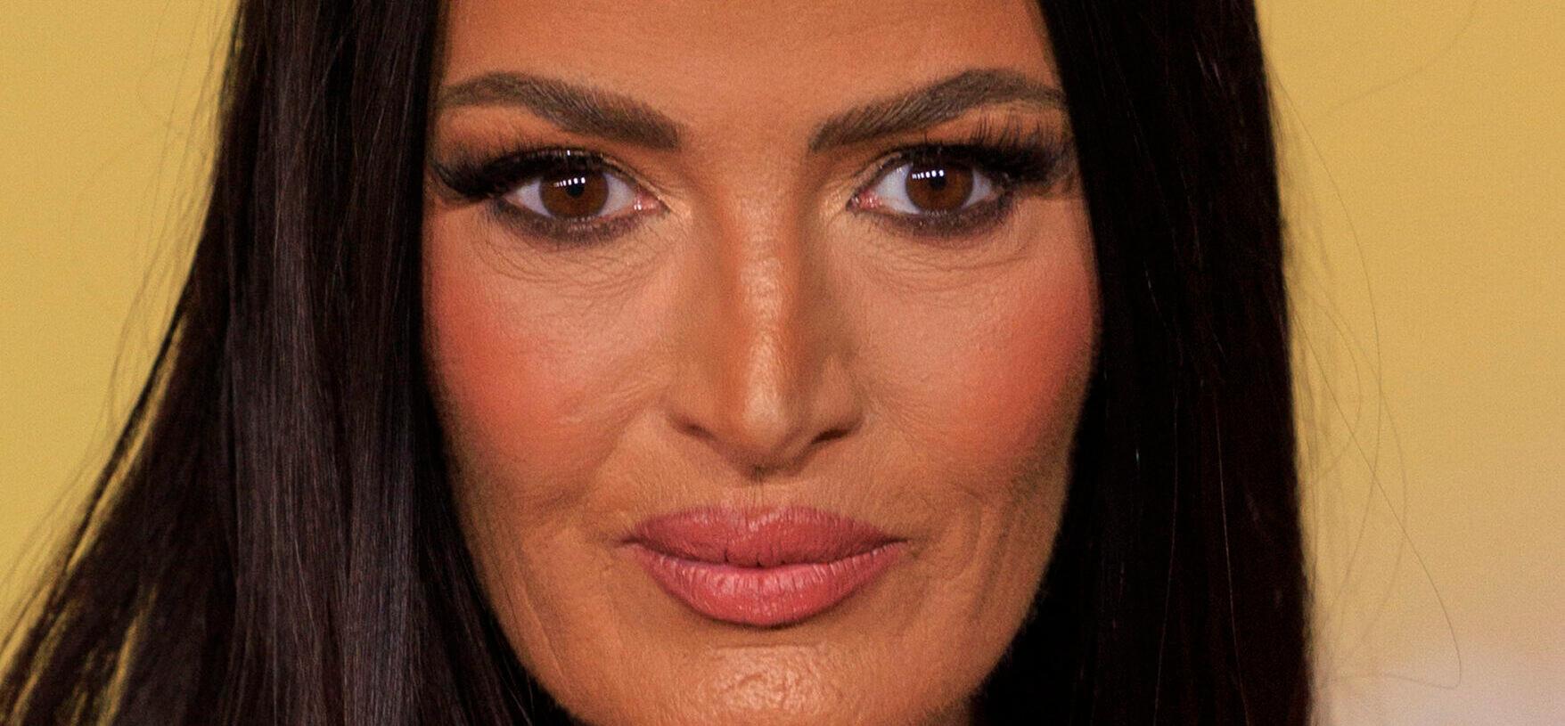 Lisa Barlow posing on the red carpet.