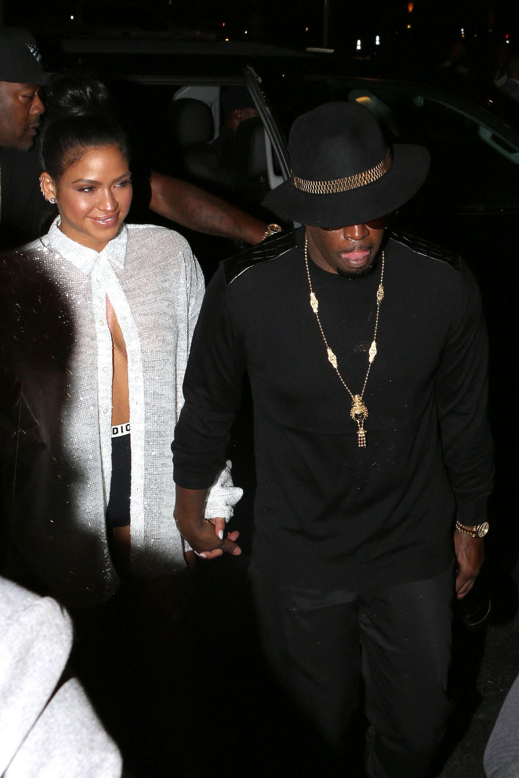 Diddy and Cassie arrive at McGregor Vs Mayweather holding a bottle of champagne