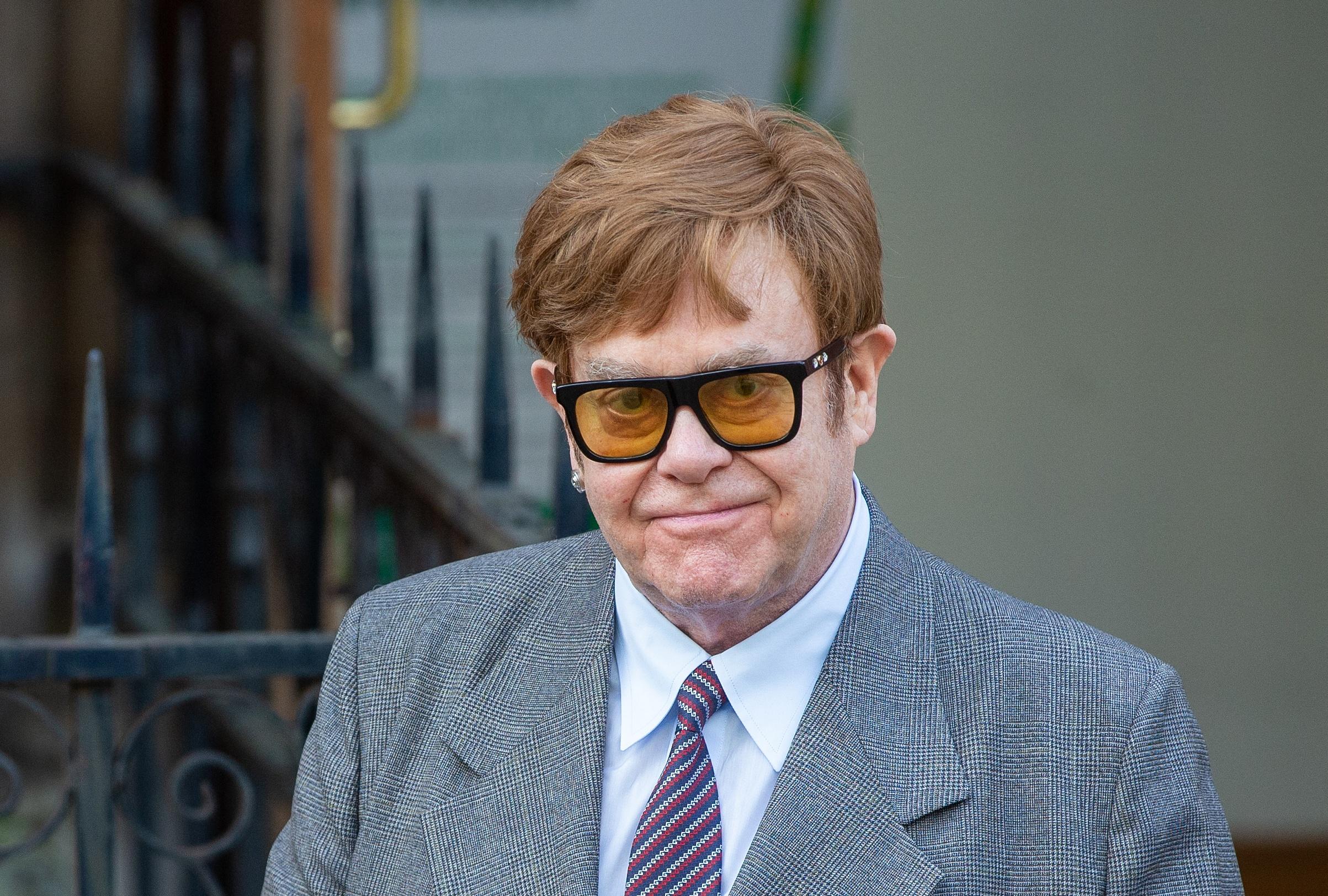 Elton John is seen leaving the High Court after Associated Newspapers hearing