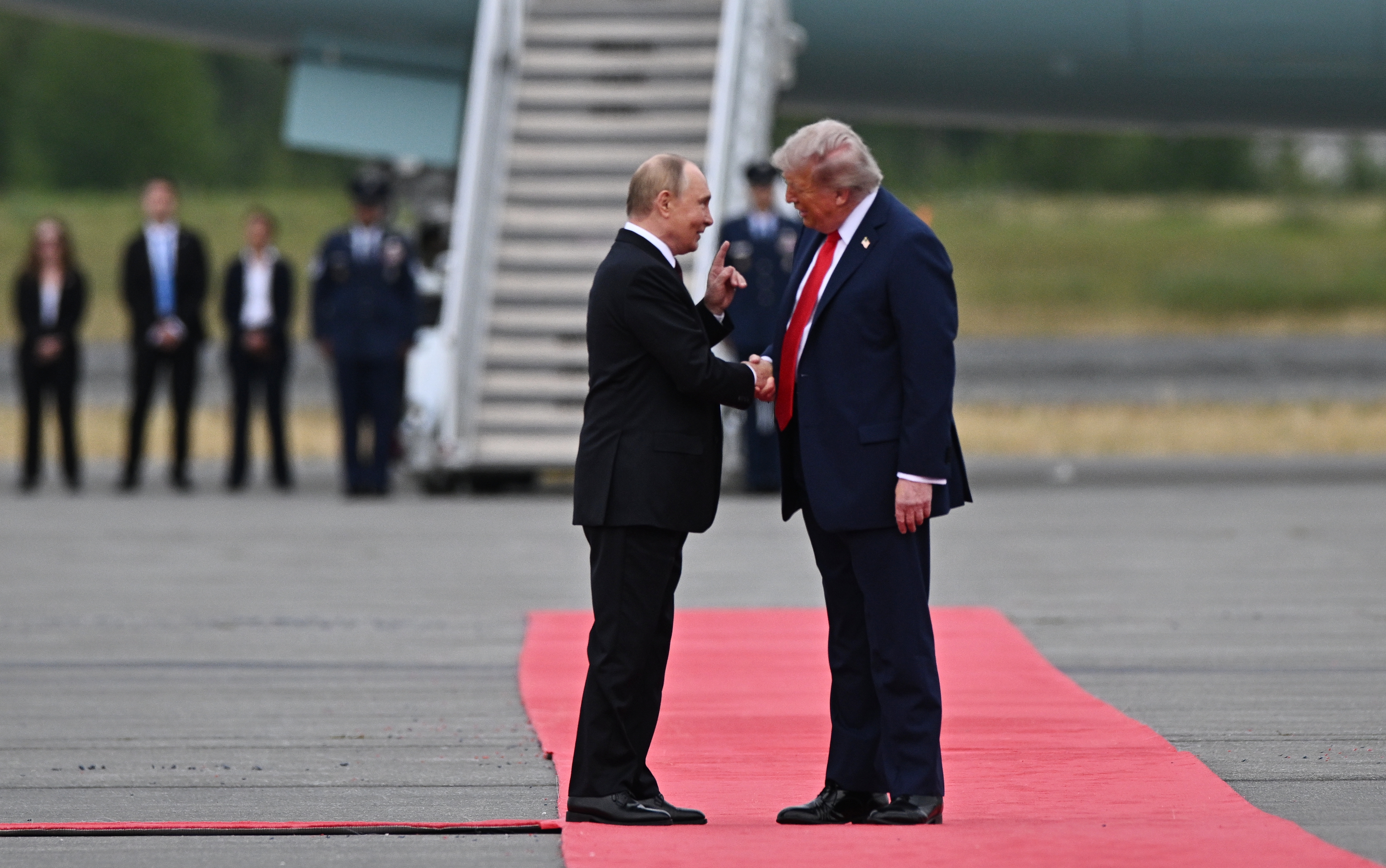 epa12303523 US President Donald Trump (R) welcomes Russian President Vladimir Putin during their meet to negotiate at Joint Base Elmendorf-Richardson in Anchorage, Alaska, USA, 15 August 2025. EPA/SERGEY BOBYLEV/SPUTNIK/KREMLIN POOL / POOL MANDATORY CREDIT