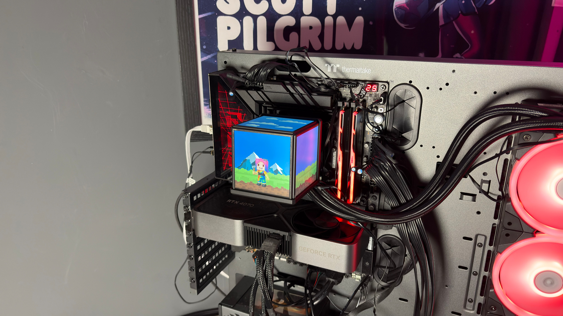 The Thermaltake Minecube 360 Ultra ARGB Sync set up on an open test bench.