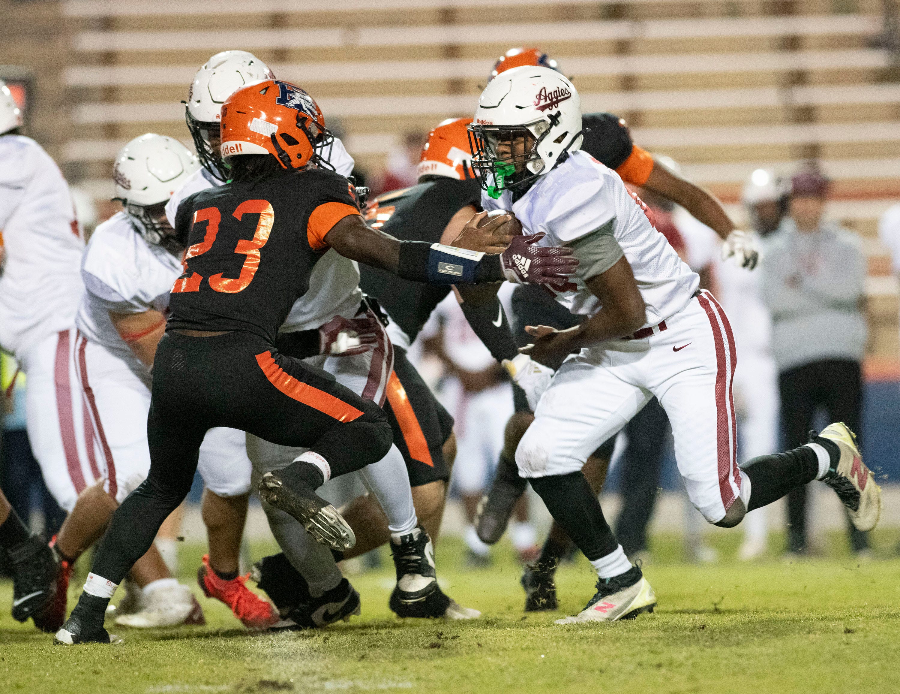 Tate's Tanner Clark (No. 23) looks for a break in the Escambia defense during Thursday's last regular season football game on Oct. 25. 2025.