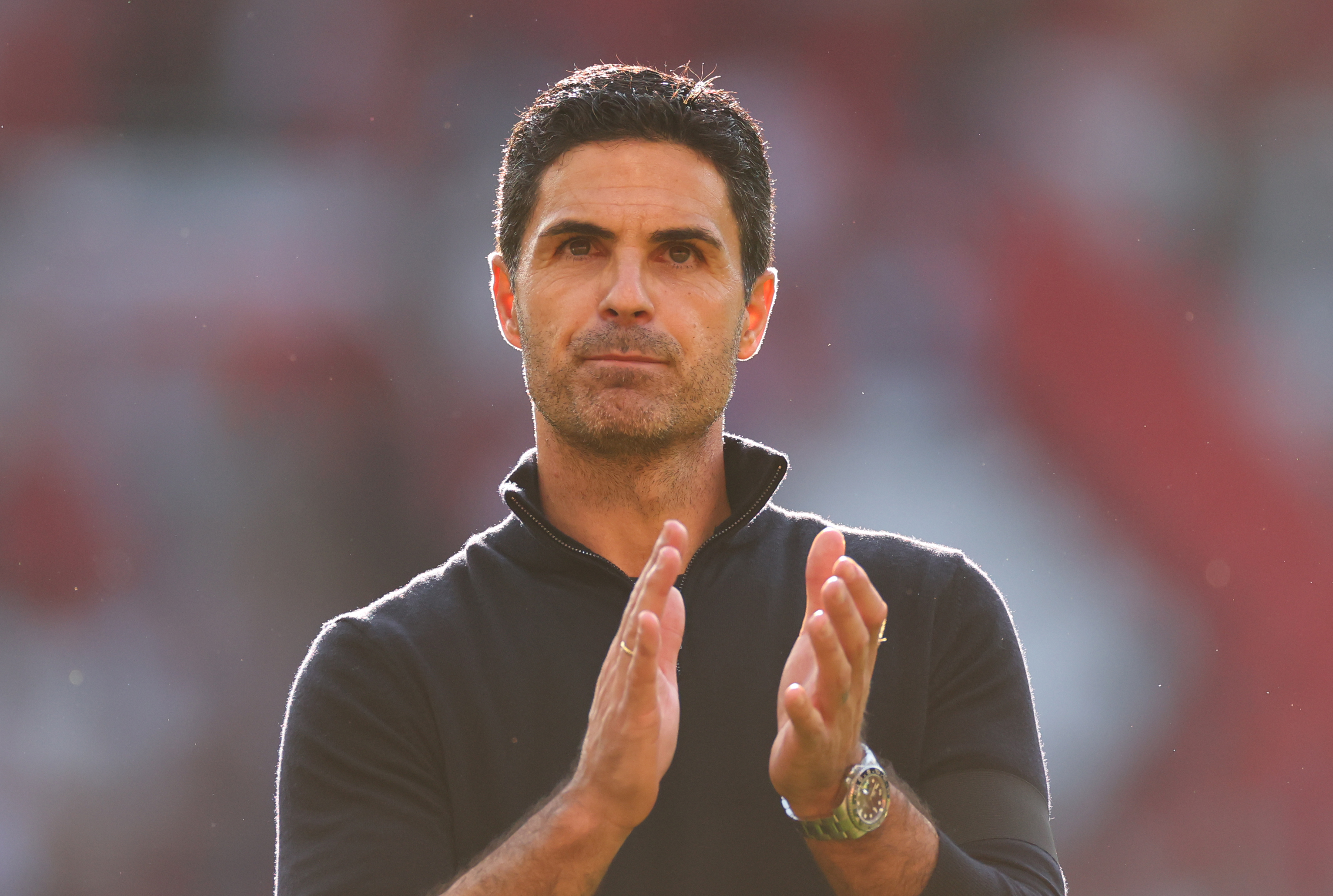MANCHESTER, ENGLAND - AUGUST 17: Mikel Arteta manager / head coach of Arsenal applauds during the Premier League match between Manchester United and Arsenal at Old Trafford on August 17, 2025 in Manchester, England. (Photo by Marc Atkins/Getty Images)