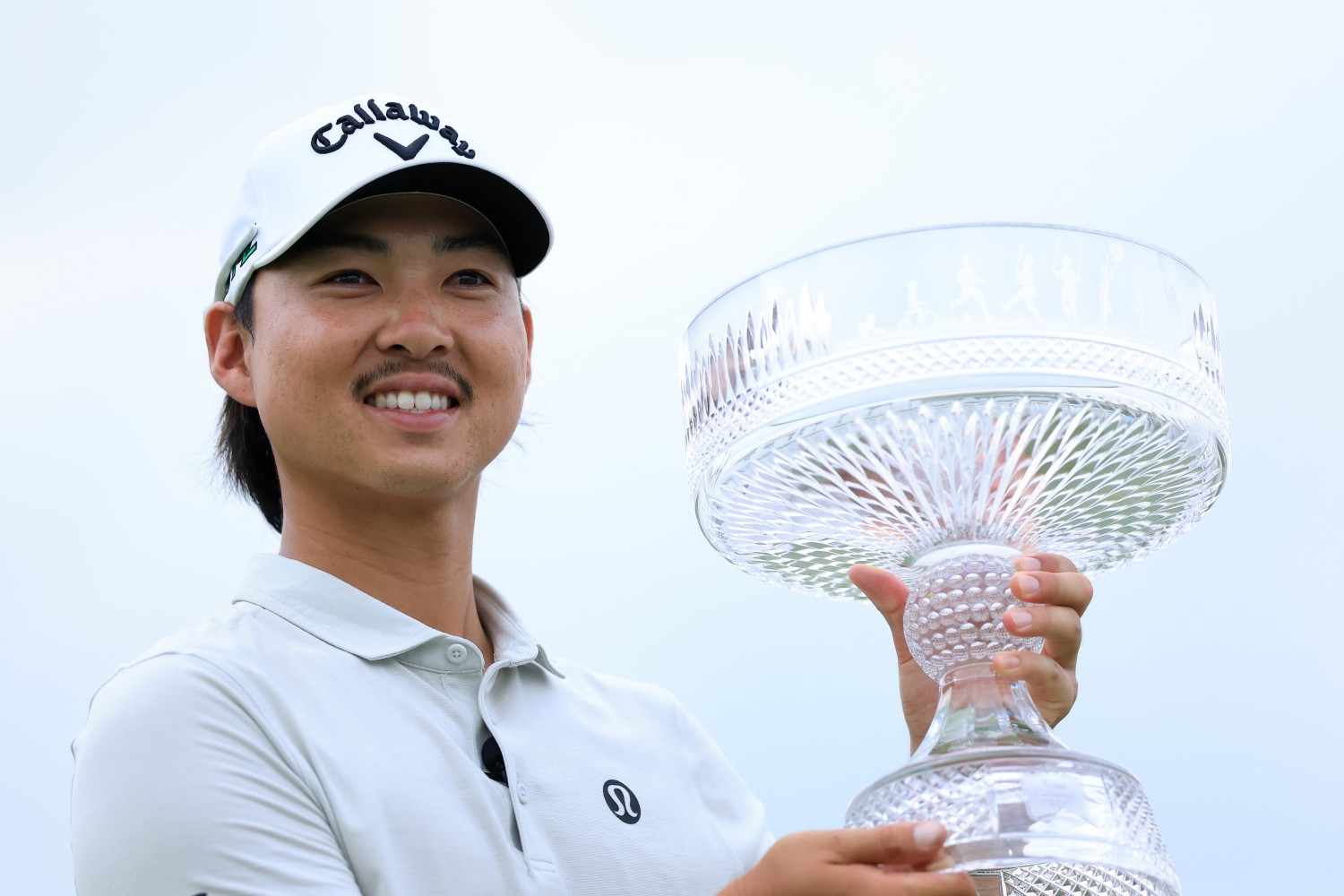 HOUSTON, TEXAS - MARCH 30: Min Woo Lee of Australia celebrates with the trophy after winning the Texas Children's Houston Open 2025 at Memorial Park Golf Course on March 30, 2025 in Houston, Texas. (Photo by Kenneth Richmond/Getty Images)