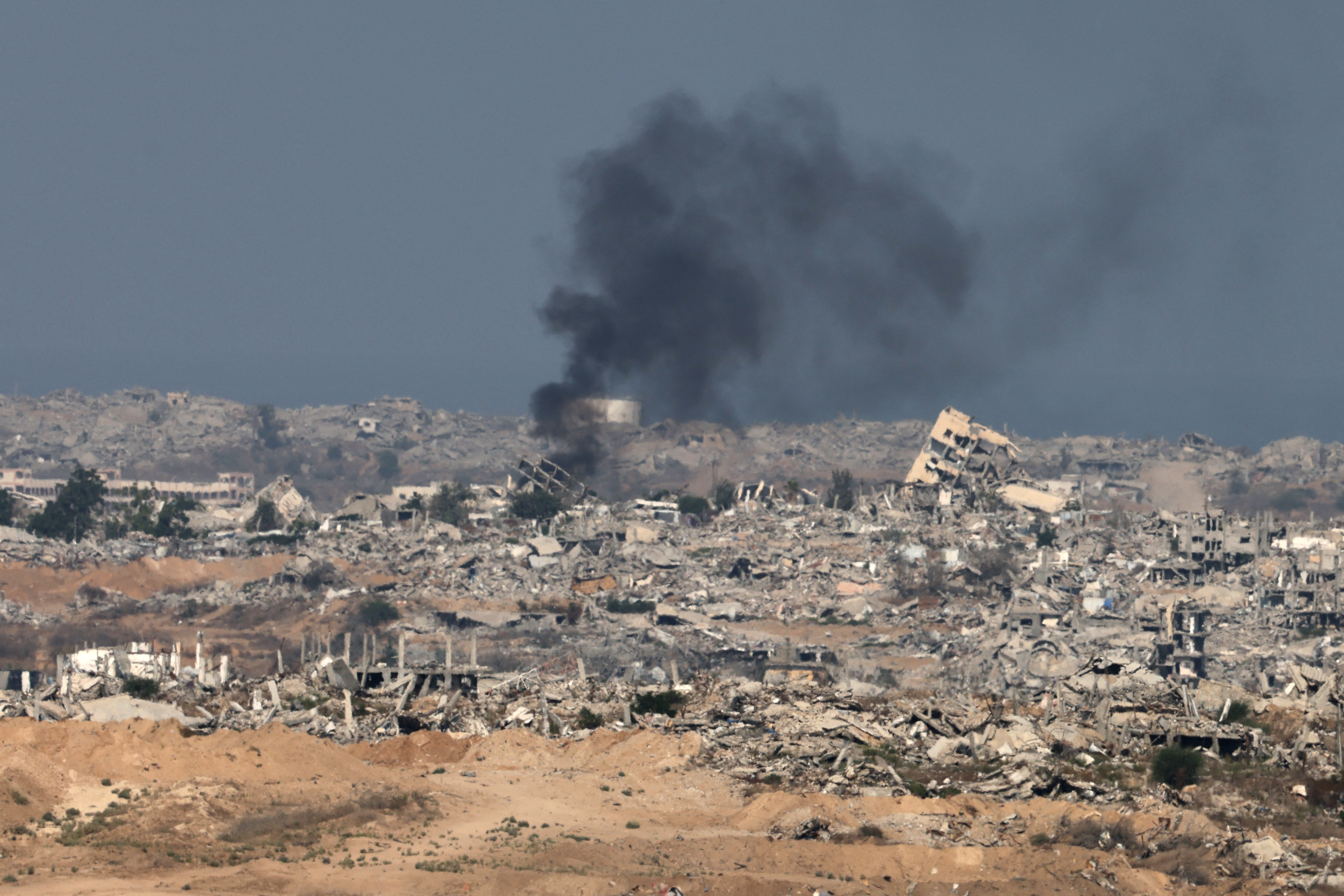 TOPSHOT - This picture taken from a position at Israel's border with the Gaza Strip shows smoke billowing amid Israeli bombardment of the besieged Palestinian territory on September 16, 2025.