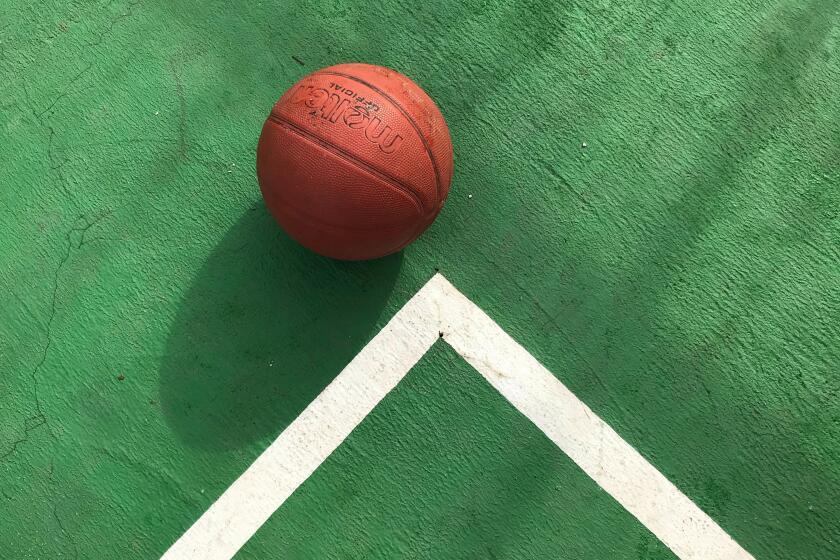 Basketball on court.