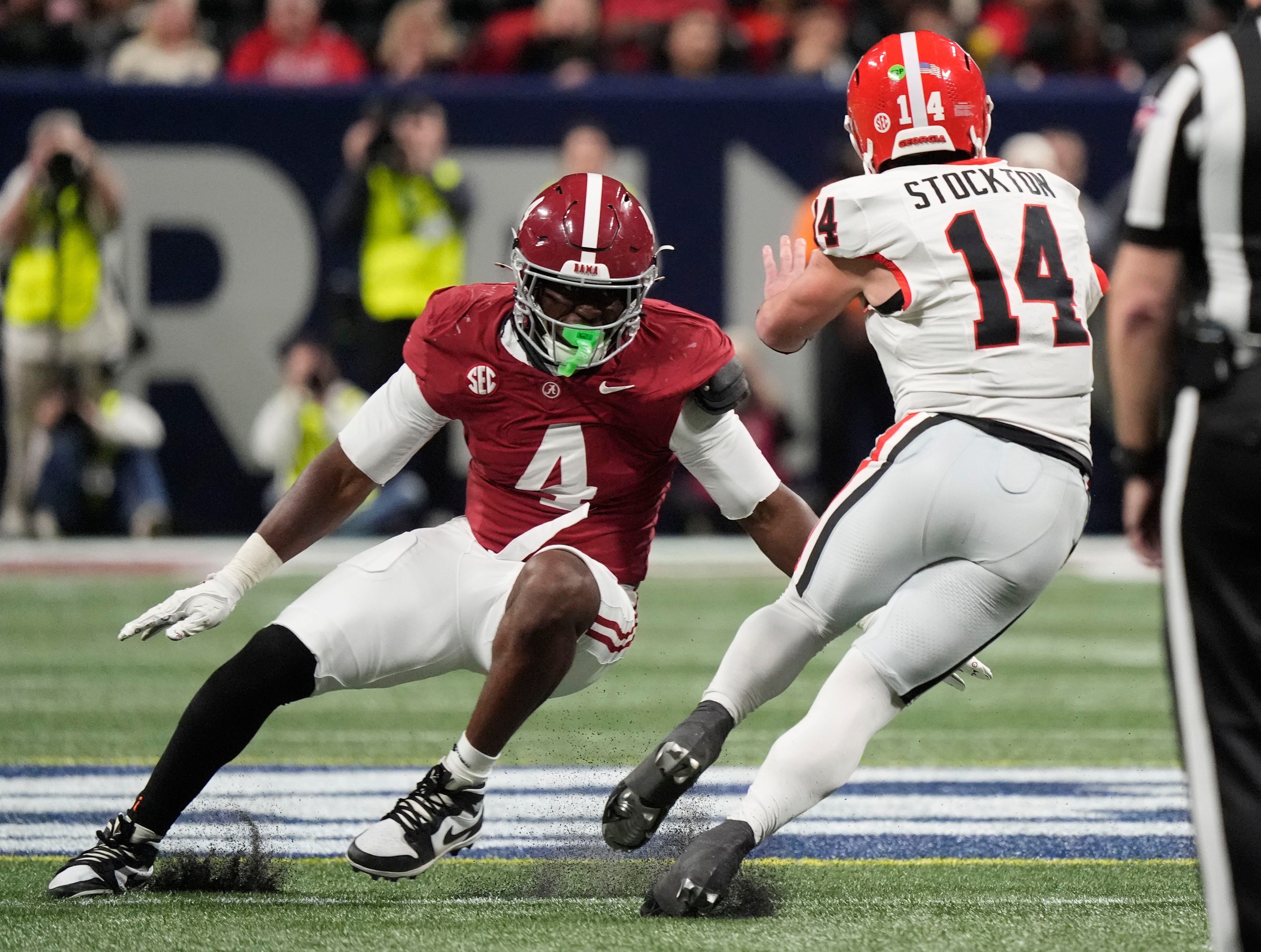 Dec 6, 2025; Atlanta, GA, USA; Alabama linebacker Qua Russaw (4) makes a tackle on Georgia quarterback Gunner Stockton (14) at Mercedes-Benz Stadium. Mandatory Credit: Gary Cosby Jr.-Tuscaloosa News