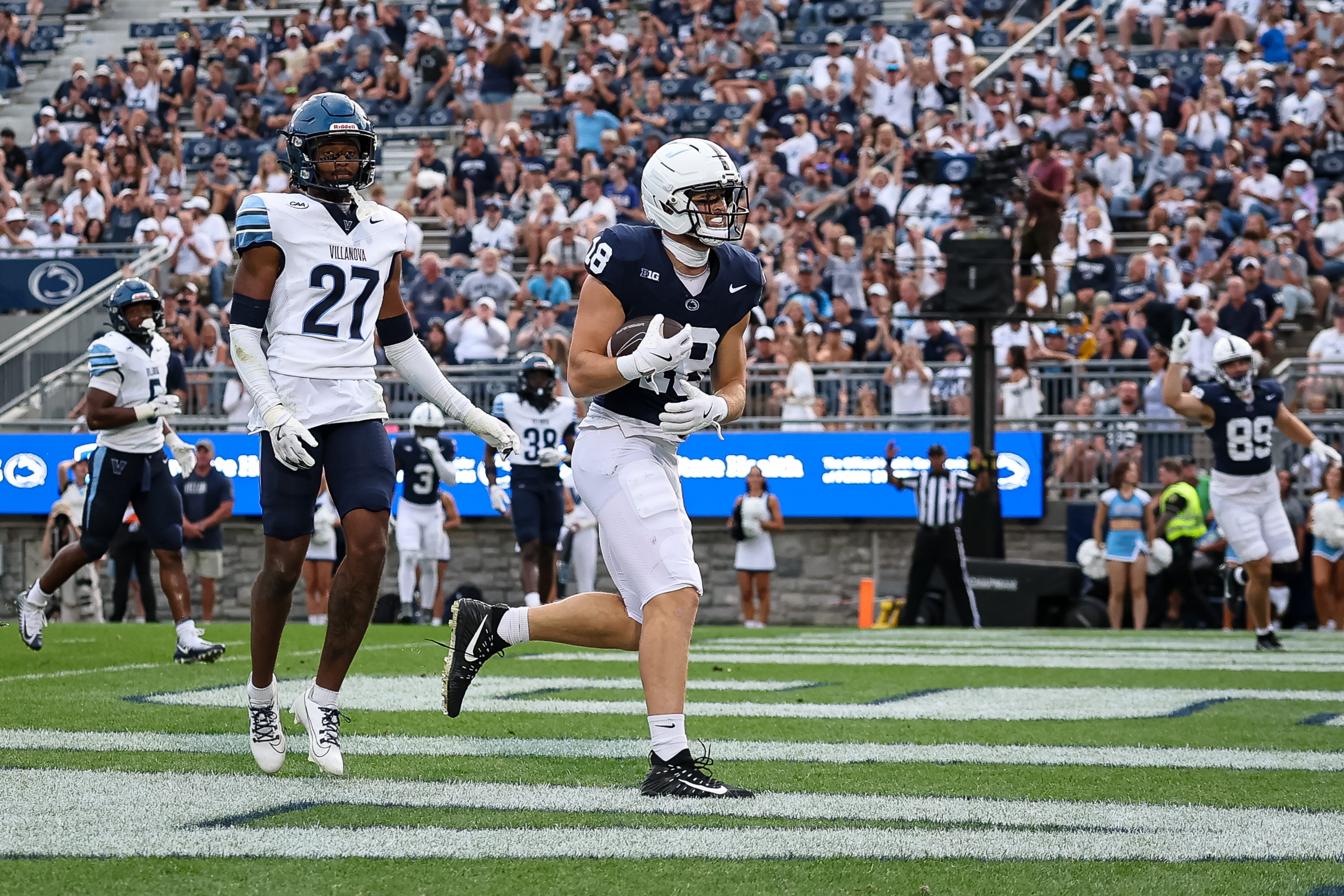 STATE COLLEGE, PA - SEPTEMBER 13: Joey Schlaffer #18 of the Penn State Nittany Lions catches a pass for a touchdown in front of Anthony Hawkins #27 of the Villanova Wildcats during the second half at West Shore Home Field at Beaver Stadium on September 13, 2025 in State College, Pennsylvania. (Photo by Scott Taetsch/Getty Images)