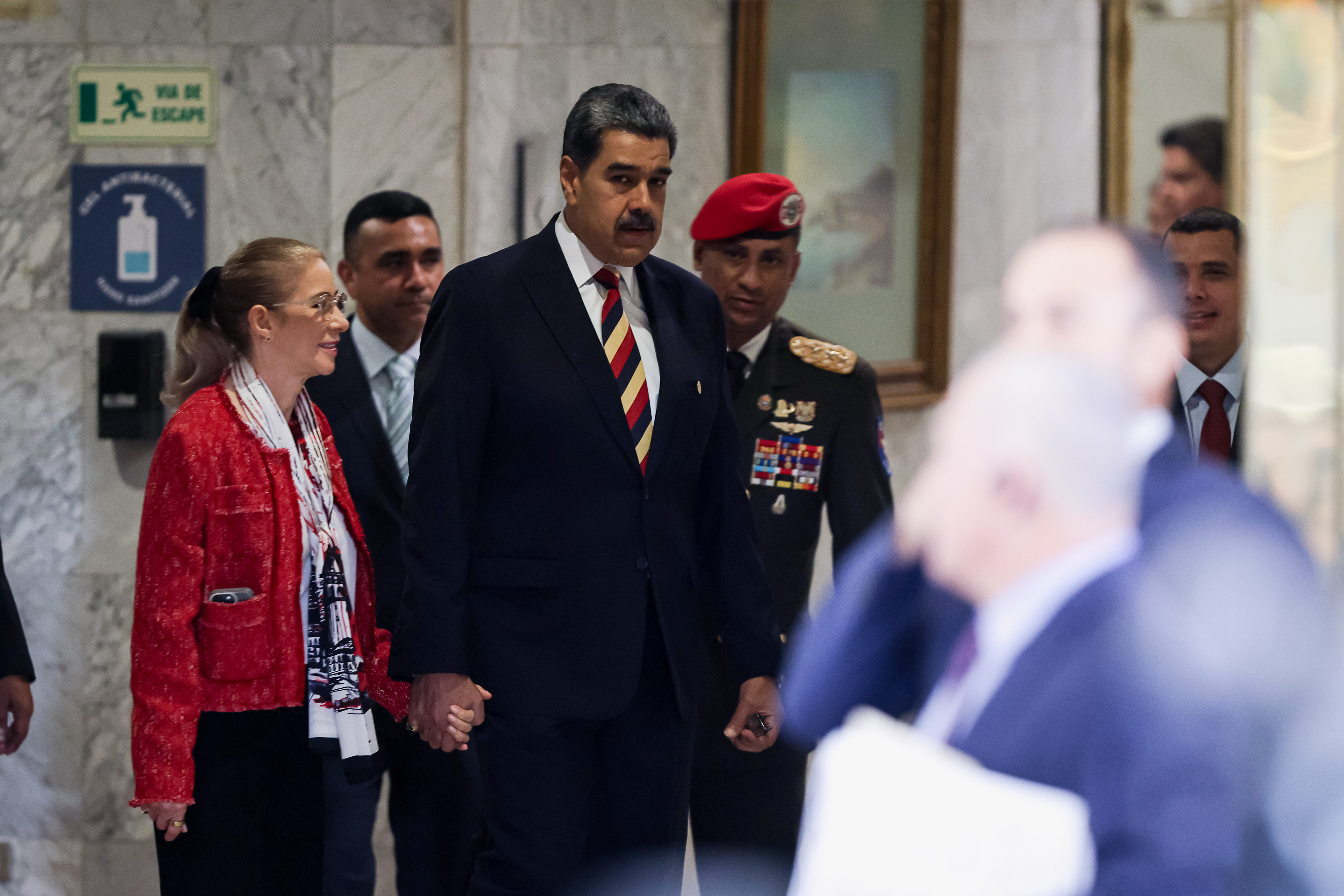 CARACAS, VENEZUELA - SEPTEMBER 01: President of Venezuela Nicol&aacute;s Maduro, alongside his wife, Cilia Flores, arrives at a press conference at Hotel Melia Caracas on September 01, 2025 in Caracas, Venezuela. Maduro stated that his government is targeted by 8 military ships and 1,200 misiles; what he called the largest threat on Venezuela in the last 100 years. (Photo by Jesus Vargas/Getty Images)