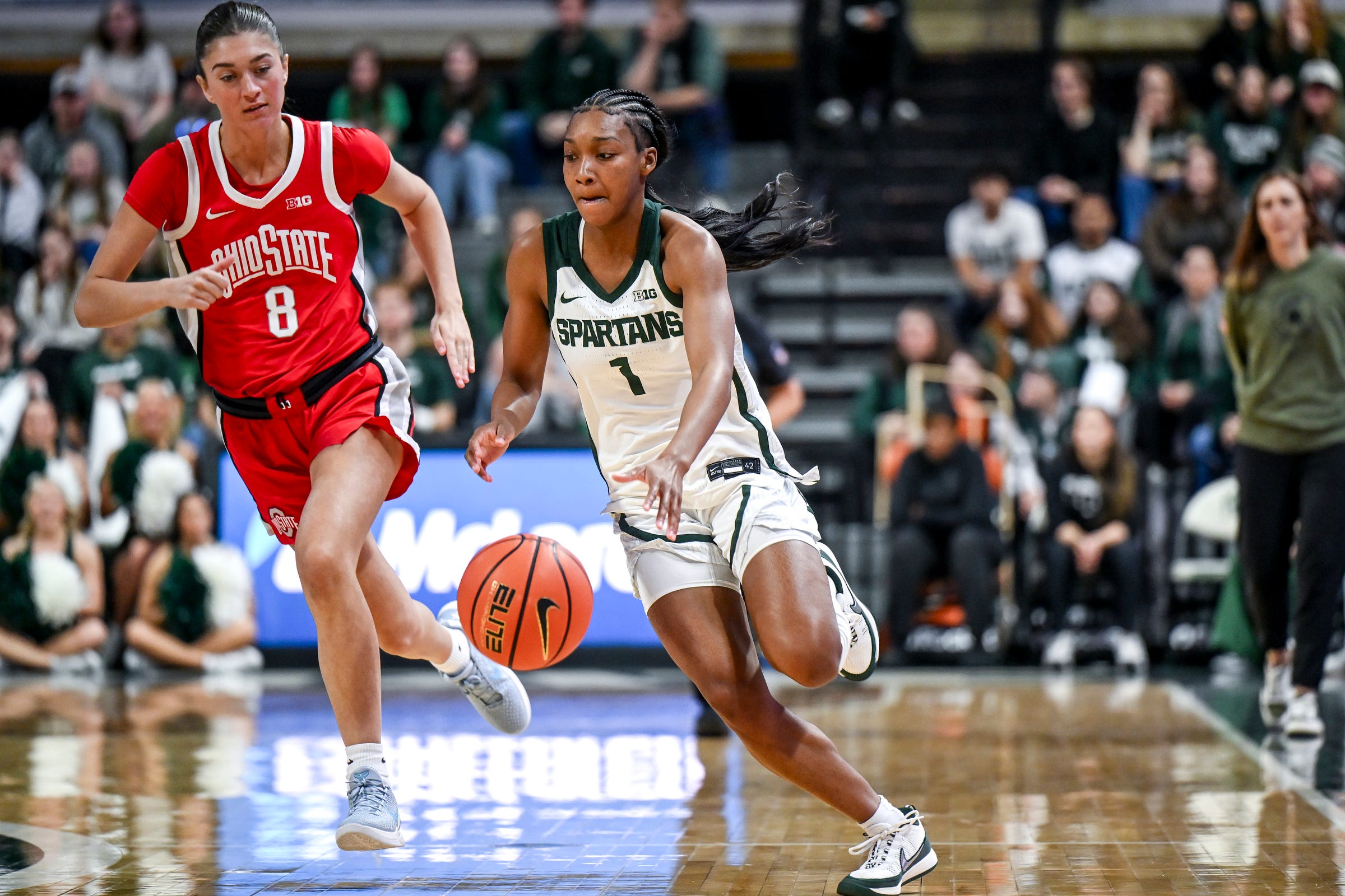 Michigan State's Rashunda Jones, right, moves the ball as Ohio State's Bryn Martin, left, defends during the first quarter on Sunday, March 1, 2026, at the Breslin Center in East Lansing.
