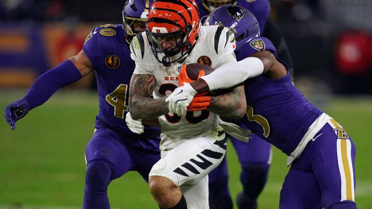 Cincinnati Bengals running back Chase Brown (30) rushed the ball against Baltimore Ravens cornerback Chidobe Awuzie (3) during the second half at M&T Bank Stadium.