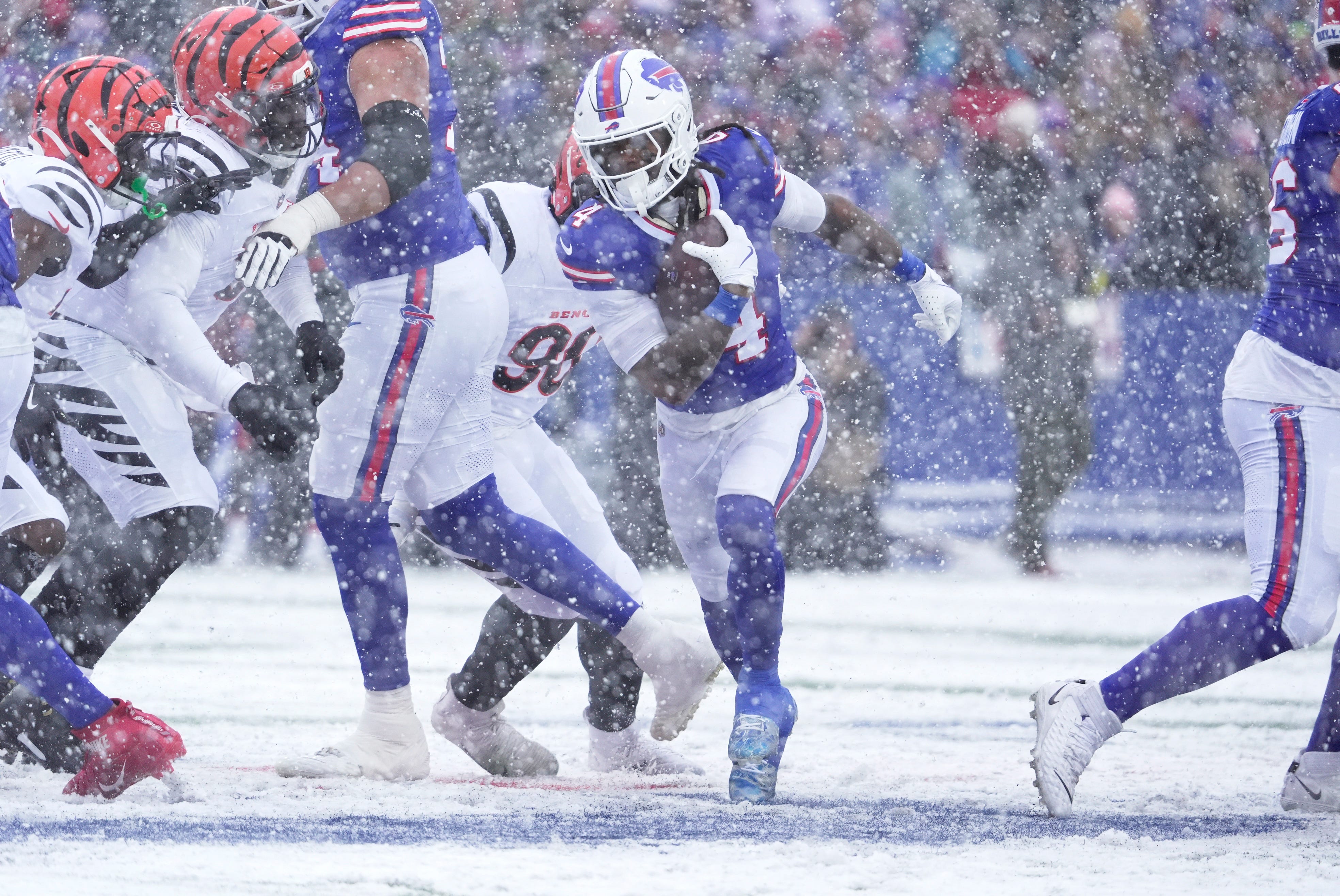 Buffalo Bills running back James Cook III slilps through a hole for a gain of about five yards during first half action at Highmark Stadium in Orchard Park on Dec. 7, 2025.