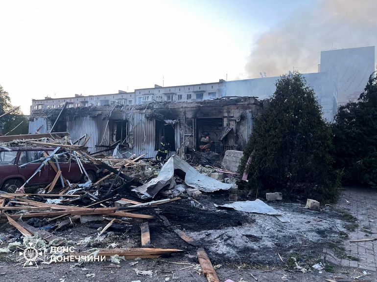 This handout picture taken and released by Ukrainian State Emergency Service on July 16, 2025 shows firefighters operating on a damaged civilian installation following a Russian strike in Dobropillia, Donetsk region, amid Russian invasion in Ukraine.