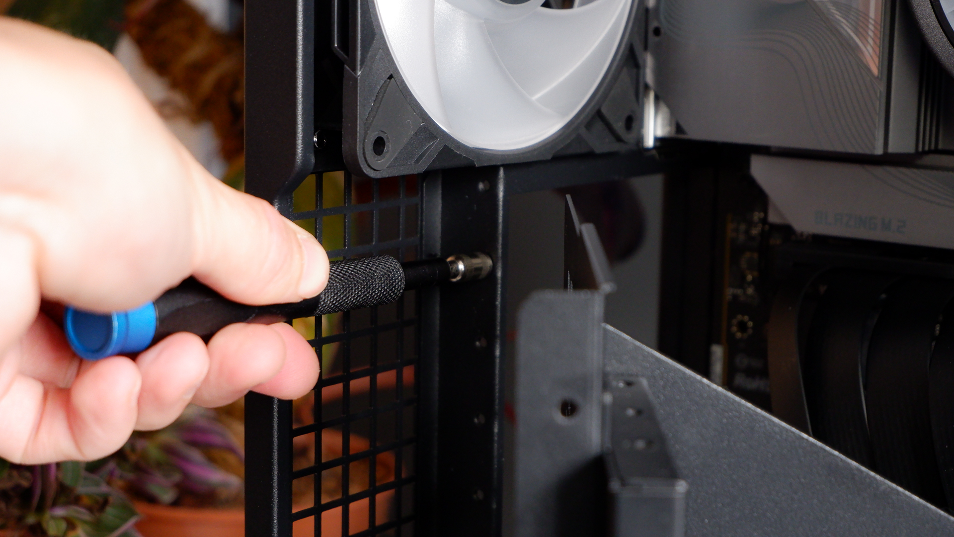 Arctic's Xtender PC case on a white desk with various parts being installed to build a functional gaming PC.