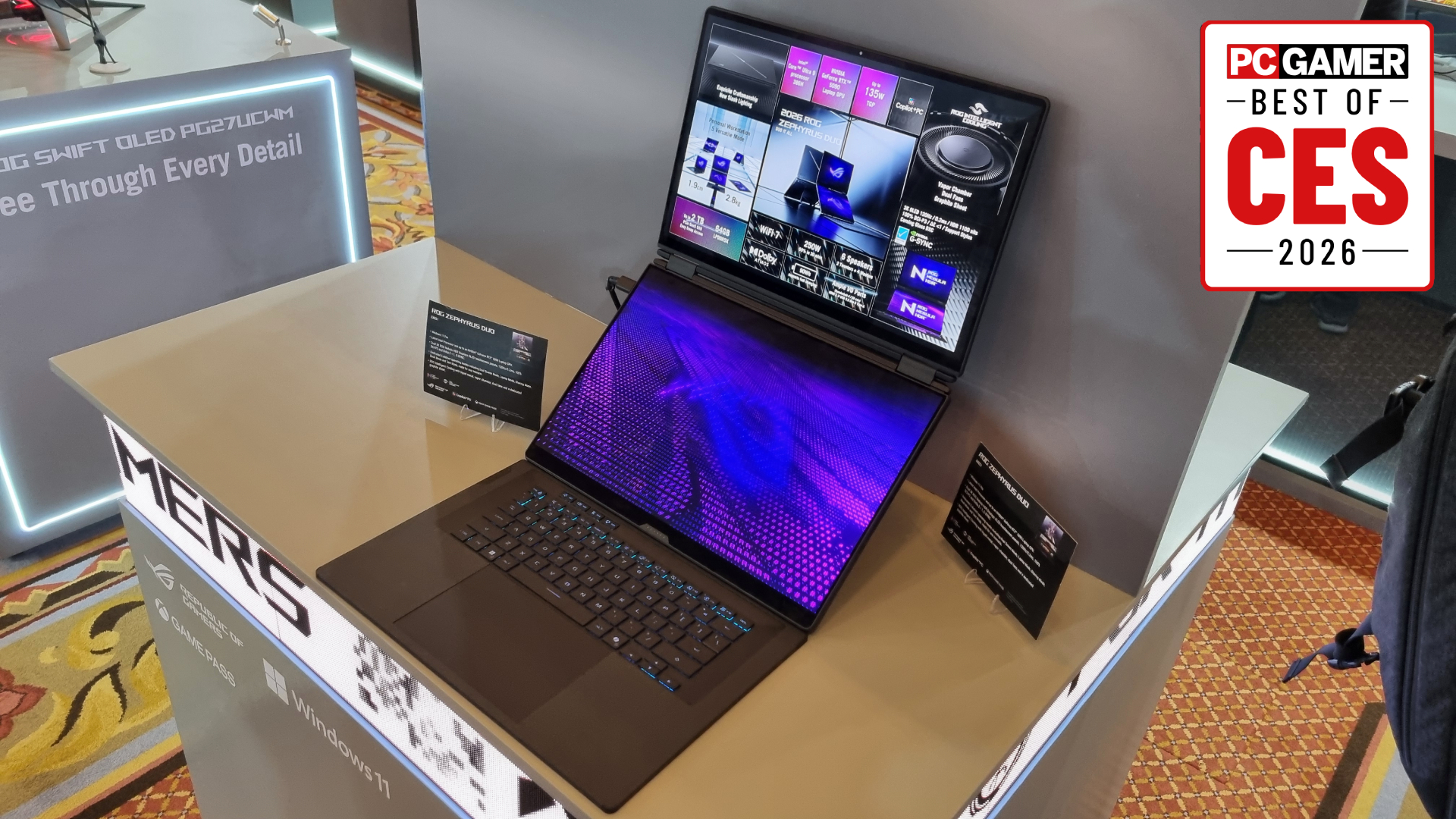 An Asus ROG Zephyrus Duo gaming laptop/tablet hybrid on display at CES 2026, with a PC Gamer Best of 2026 badge in the top right