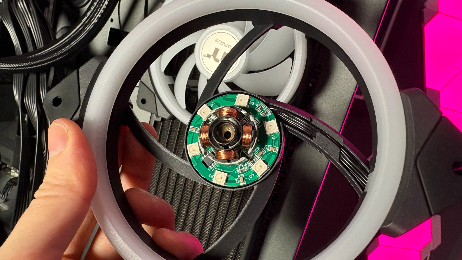 The Thermaltake Minecube 360 Ultra ARGB Sync set up on an open test bench.