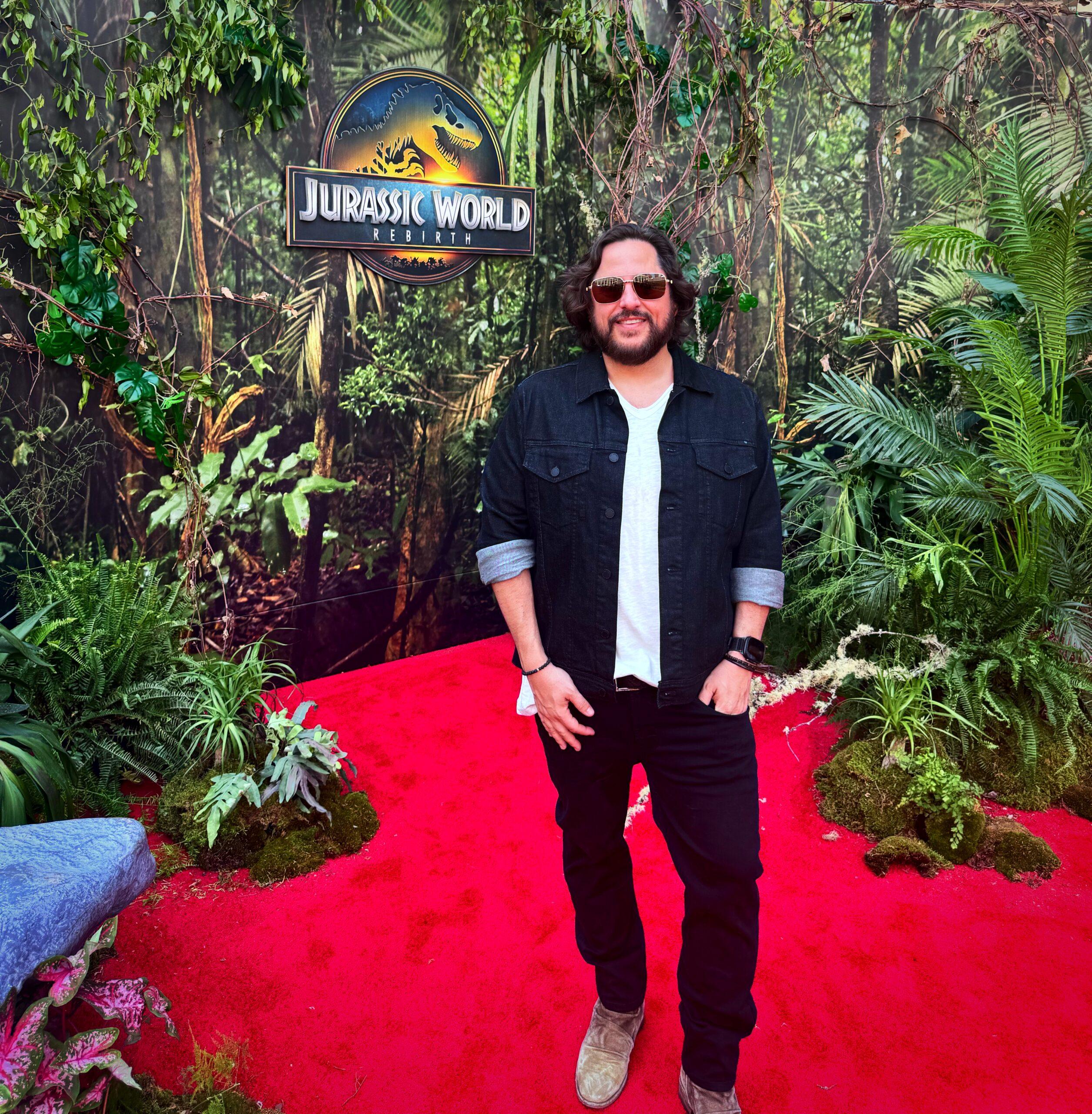 Ben Lamm in front of Jurassic World sign