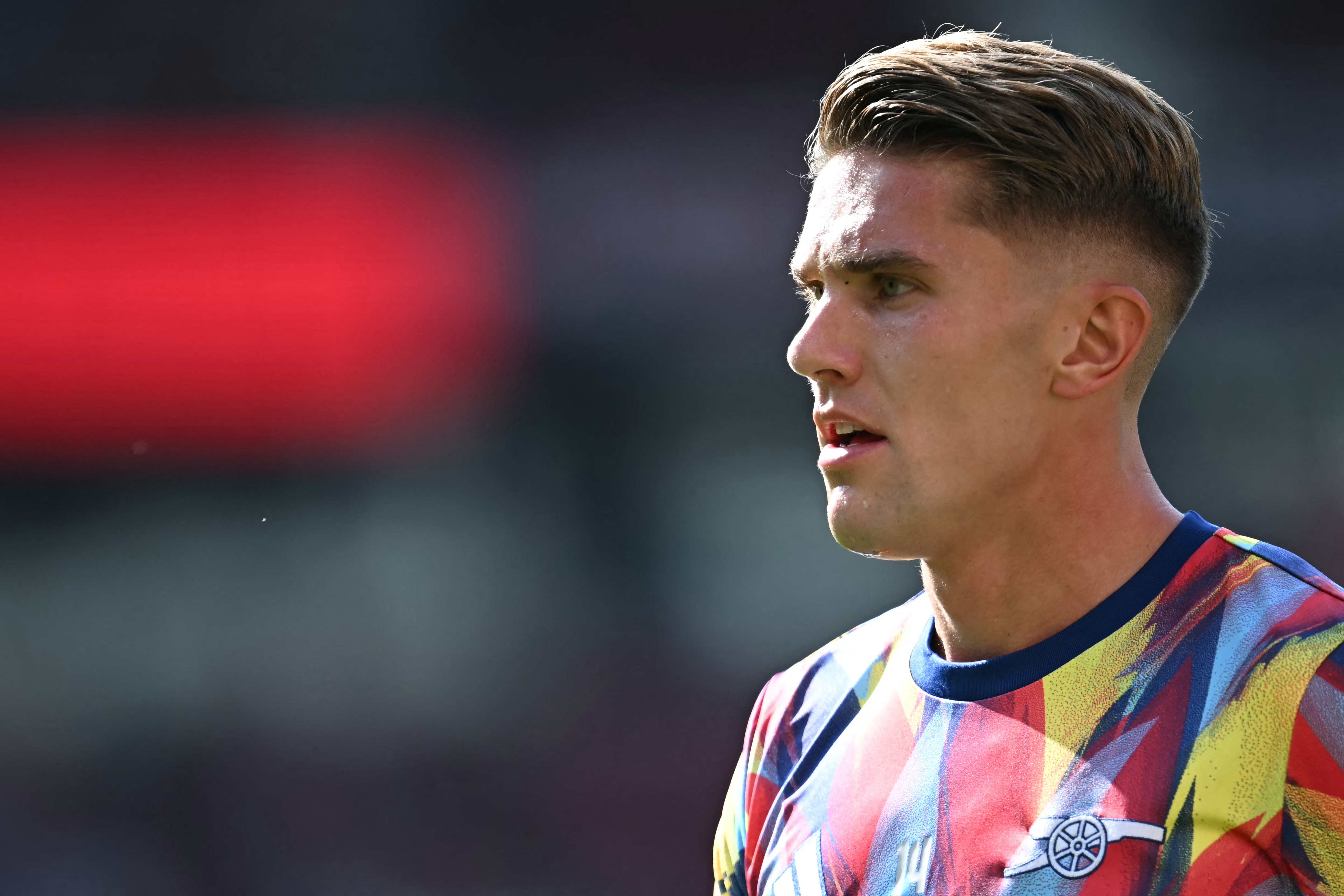 Arsenal's Swedish striker #14 Viktor Gyokeres warms up for the English Premier League football match between Manchester United and Arsenal at Old Trafford in Manchester, north west England, on August 17, 2025. (Photo by Paul ELLIS / AFP) / RESTRICTED TO EDITORIAL USE. No use with unauthorized audio, video, data, fixture lists, club/league logos or 'live' services. Online in-match use limited to 120 images. An additional 40 images may be used in extra time. No video emulation. Social media in-match use limited to 120 images. An additional 40 images may be used in extra time. No use in betting publications, games or single club/league/player publications. / (Photo by PAUL ELLIS/AFP via Getty Images)