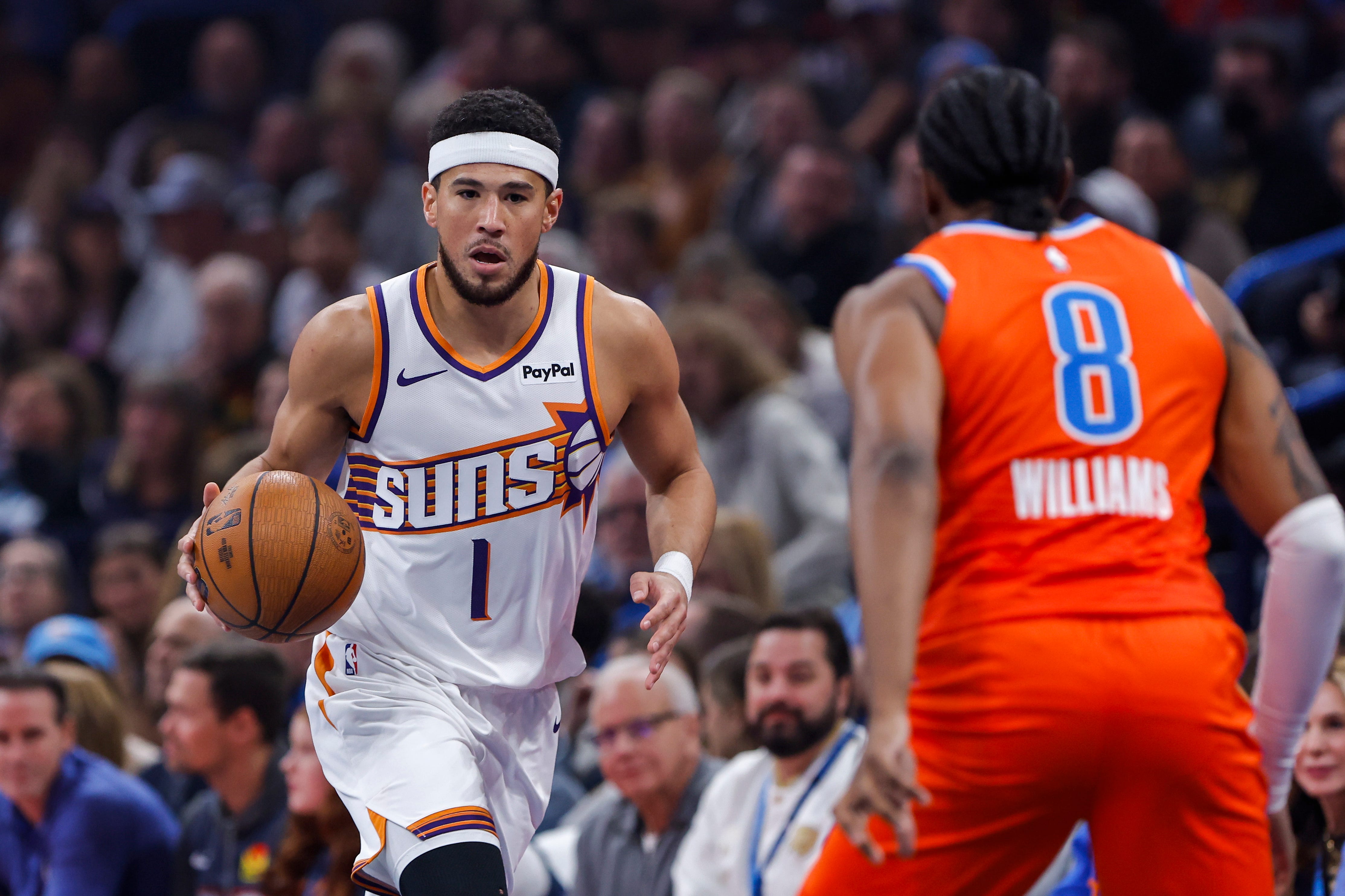 Nov 28, 2025; Oklahoma City, Oklahoma, USA;Phoenix Suns guard Devin Booker (1) dribbles down the court against the Oklahoma City Thunder during the first quarter at Paycom Center. Mandatory Credit: Alonzo Adams-Imagn Images