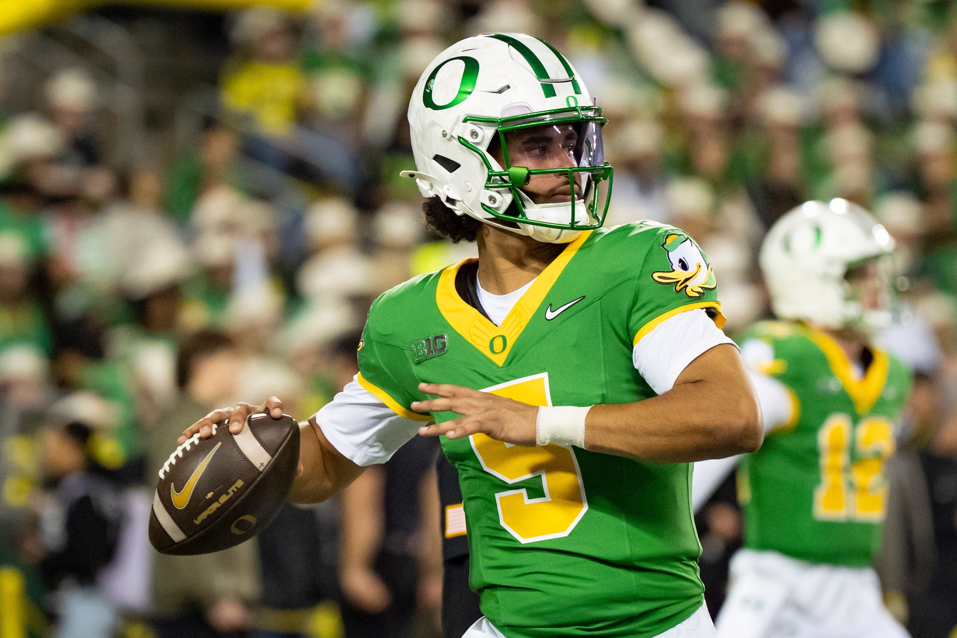 Oregon quarterback Dante Moore throws a pass before the game as the Oregon Ducks host the Minnesota Golden Gophers on Nov. 14, 2025, at Autzen Stadium in Eugene, Oregon.