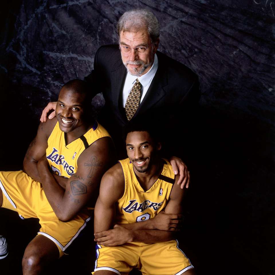 LOS ANGELES - 2000: Head Coach Phil Jackson, center, Shaquille O'Neal #34 and Kobe Bryant #8 of the Los Angeles Lakers pose for a portrait at the Staples Center circa 2000 in Los Angeles, California. NOTE TO USER: User expressly acknowledges and agrees that, by downloading and/or using this Photograph, User is consenting to the terms and conditions of the Getty Images License Agreement. Mandatory Copyright Notice: Copyright 2000 NBAE. (Photo by Andrew D. Bernstein/NBAE via Getty Images)