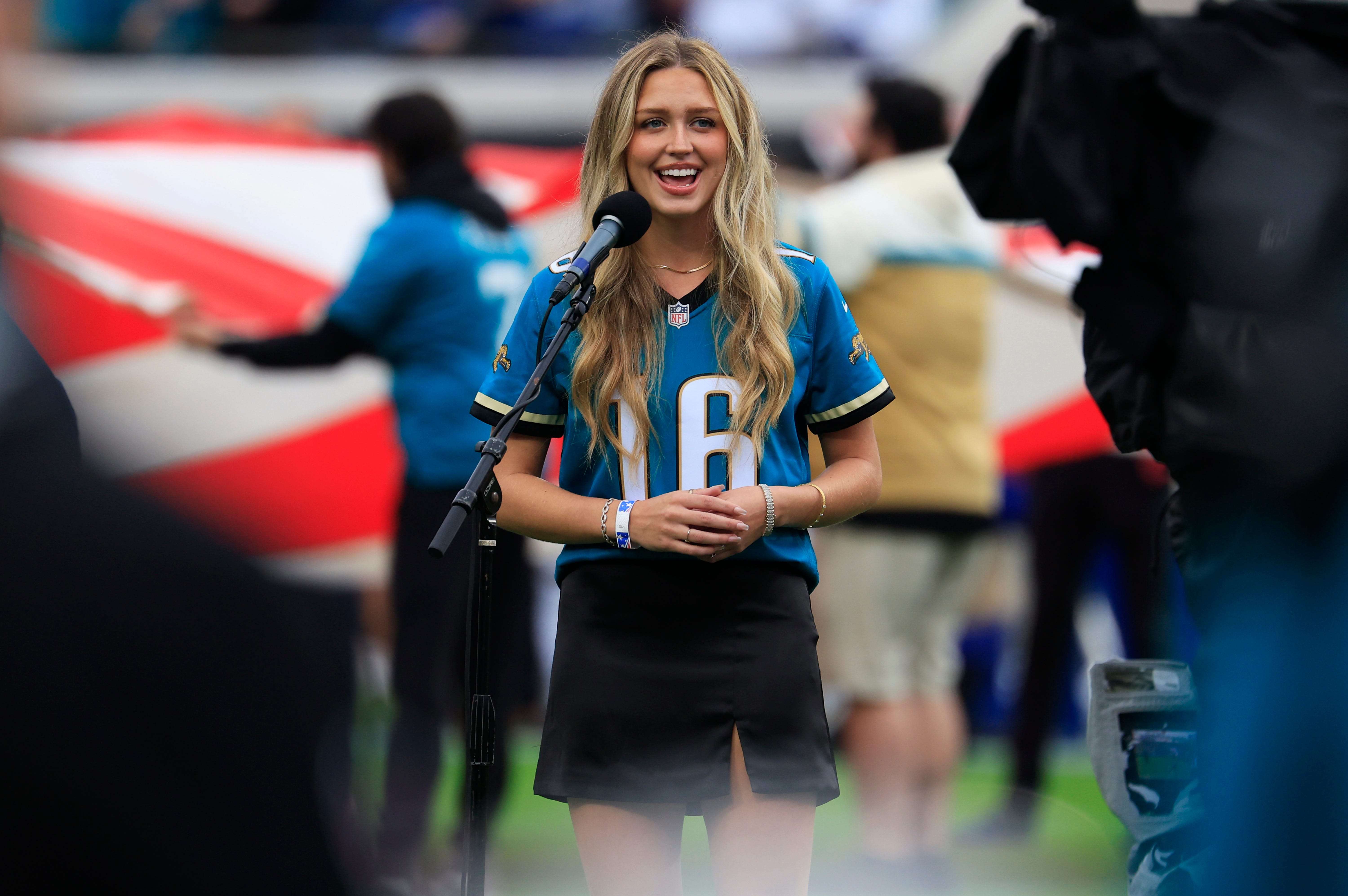 Grbrielle Slebos sings the national anthem before an NFL football game at EverBank Stadium, Sunday, Dec. 7, 2025, in Jacksonville, Fla. The Jaguars defeated the Colts 36-19.